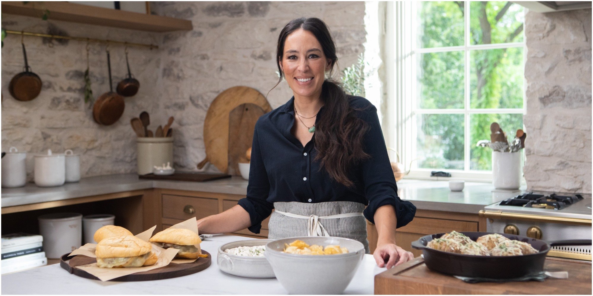 Joanna Gaines cooks in the kitchen of her discovery+ show.