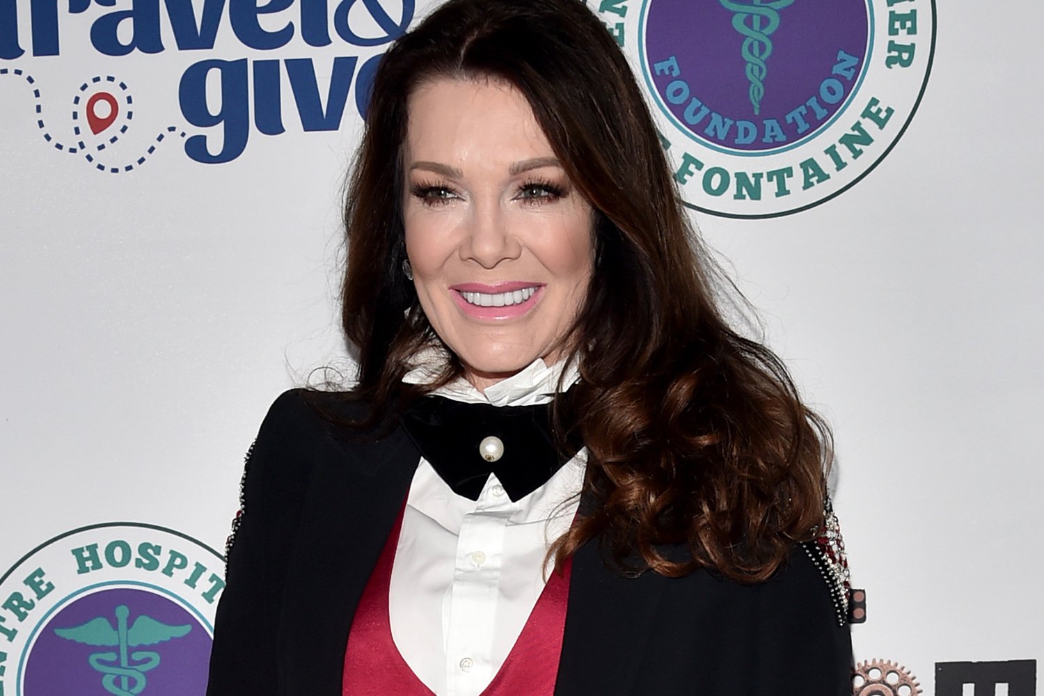 Lisa Vanderpump smiling, wearing a tuxedo