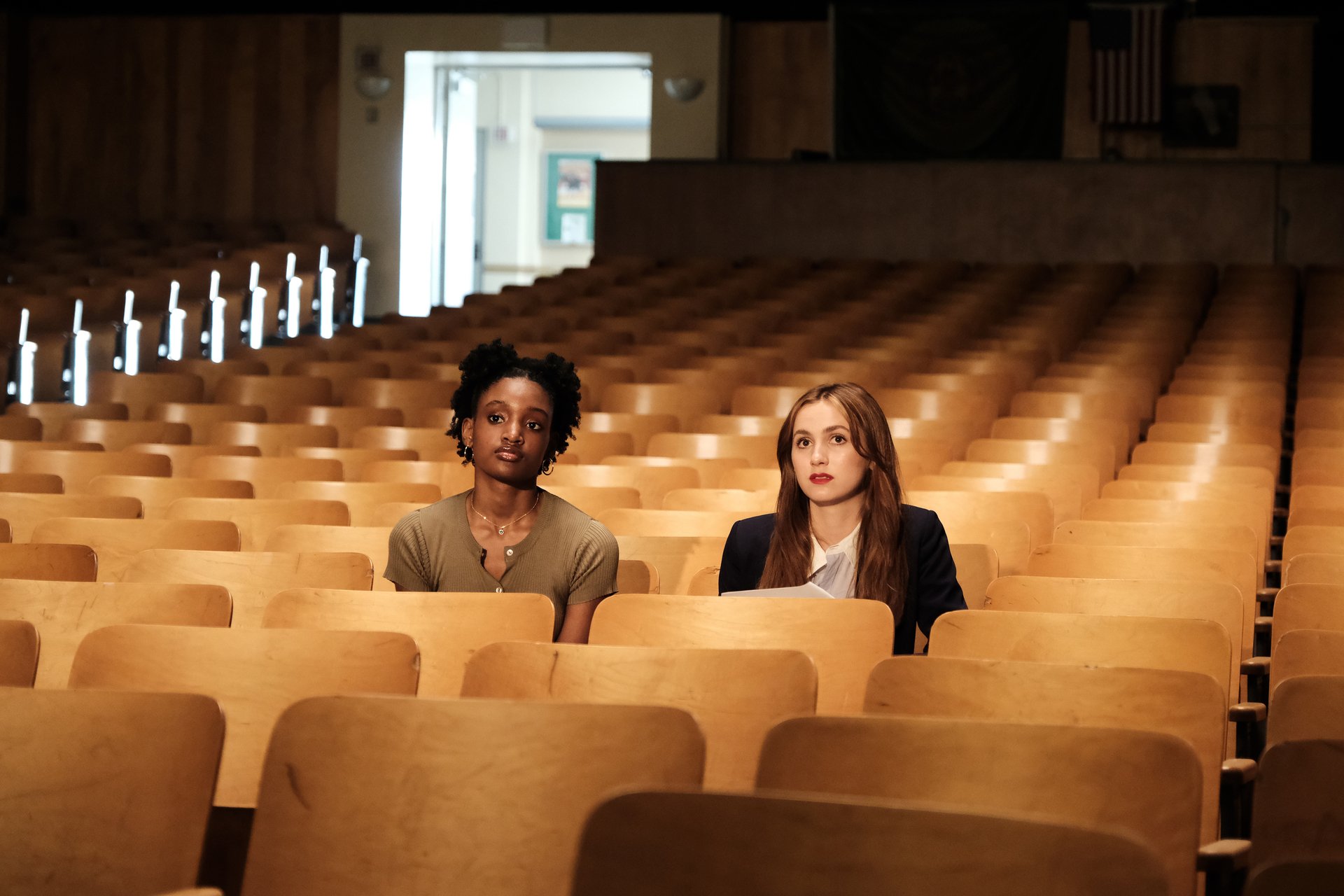A classmate sits with Lexi (Maude Apatow) in the school auditorium preparing for her play in 'Euphoria'
