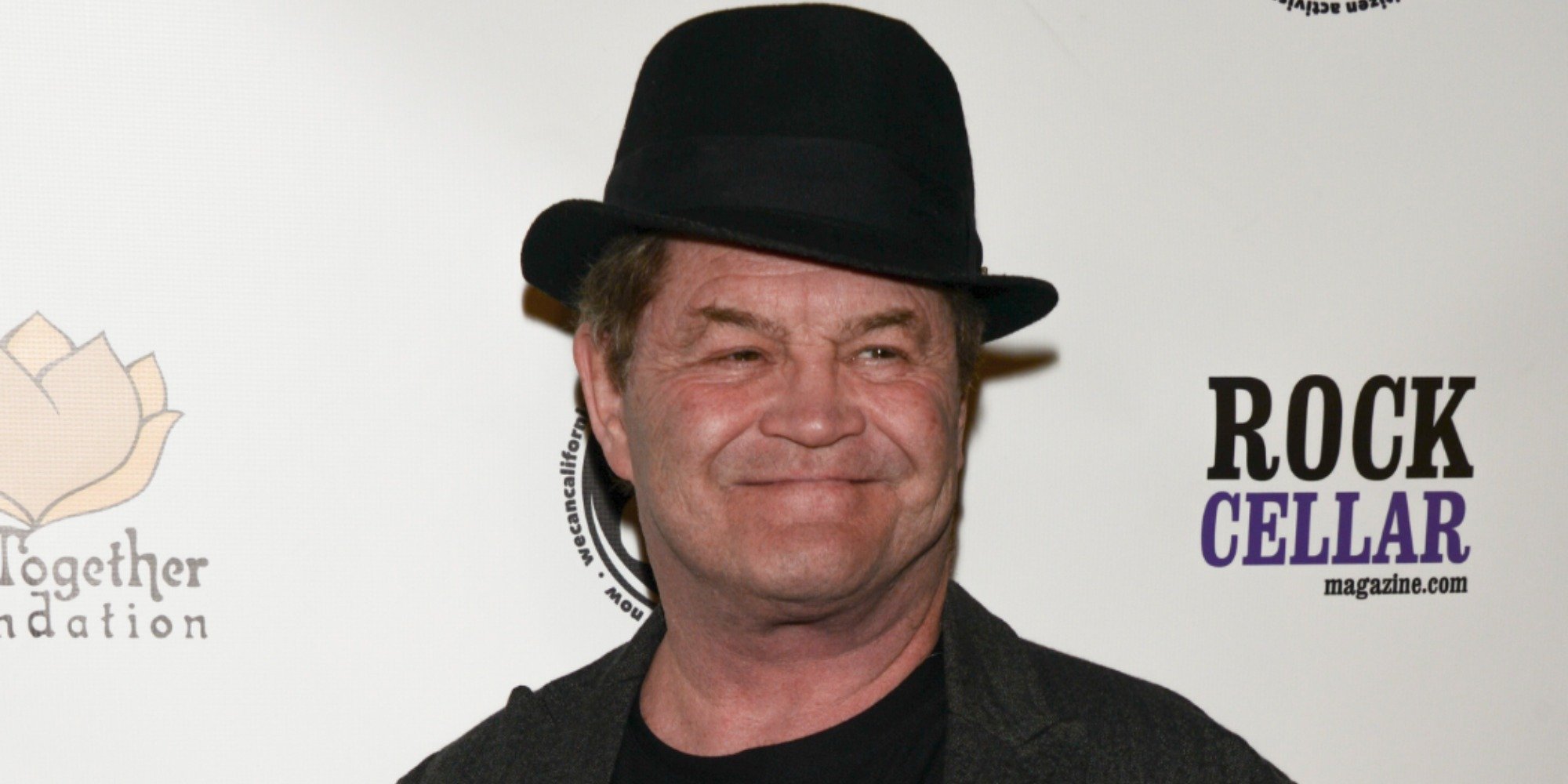 Micky Dolenz poses for a paparazzi photograph.