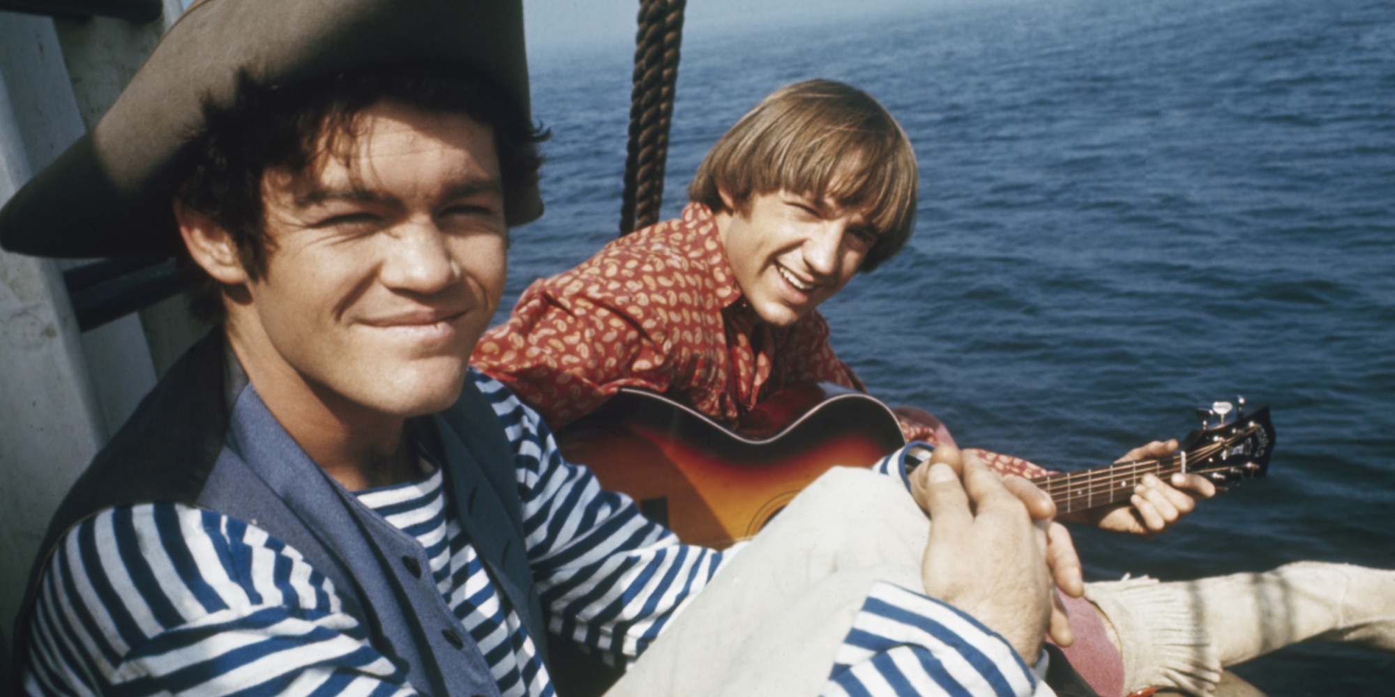 The Monkees members Micky Dolenz and Peter Tork on a boat.