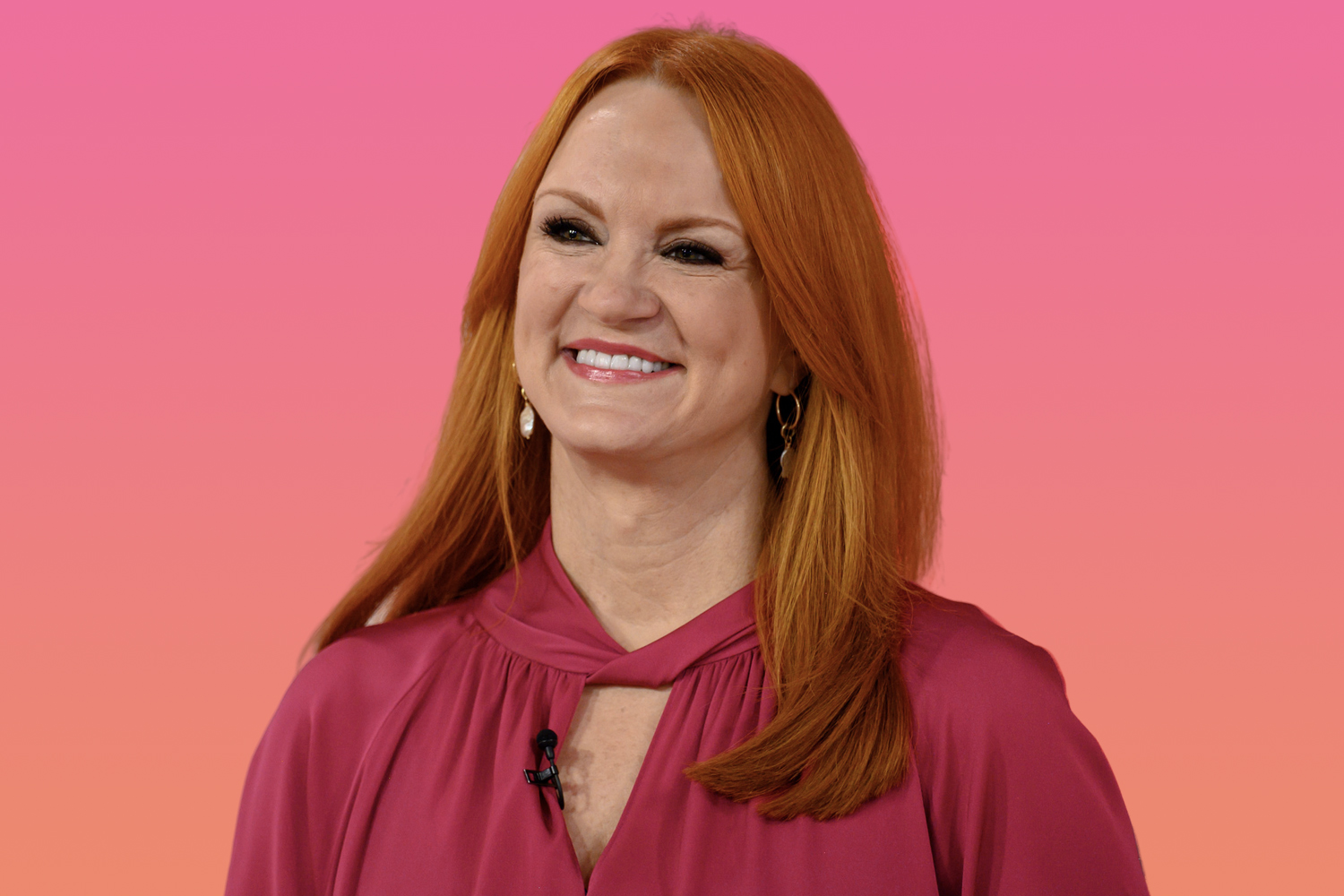 Ree Drummond smiling and wearing a fuchsia-colored top
