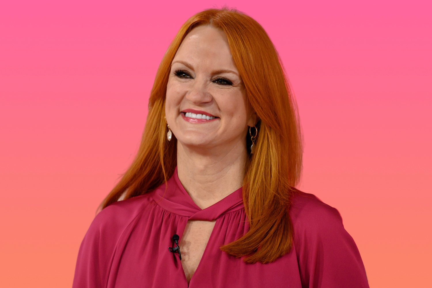 Ree Drummond smiling and wearing a fuchsia-colored top