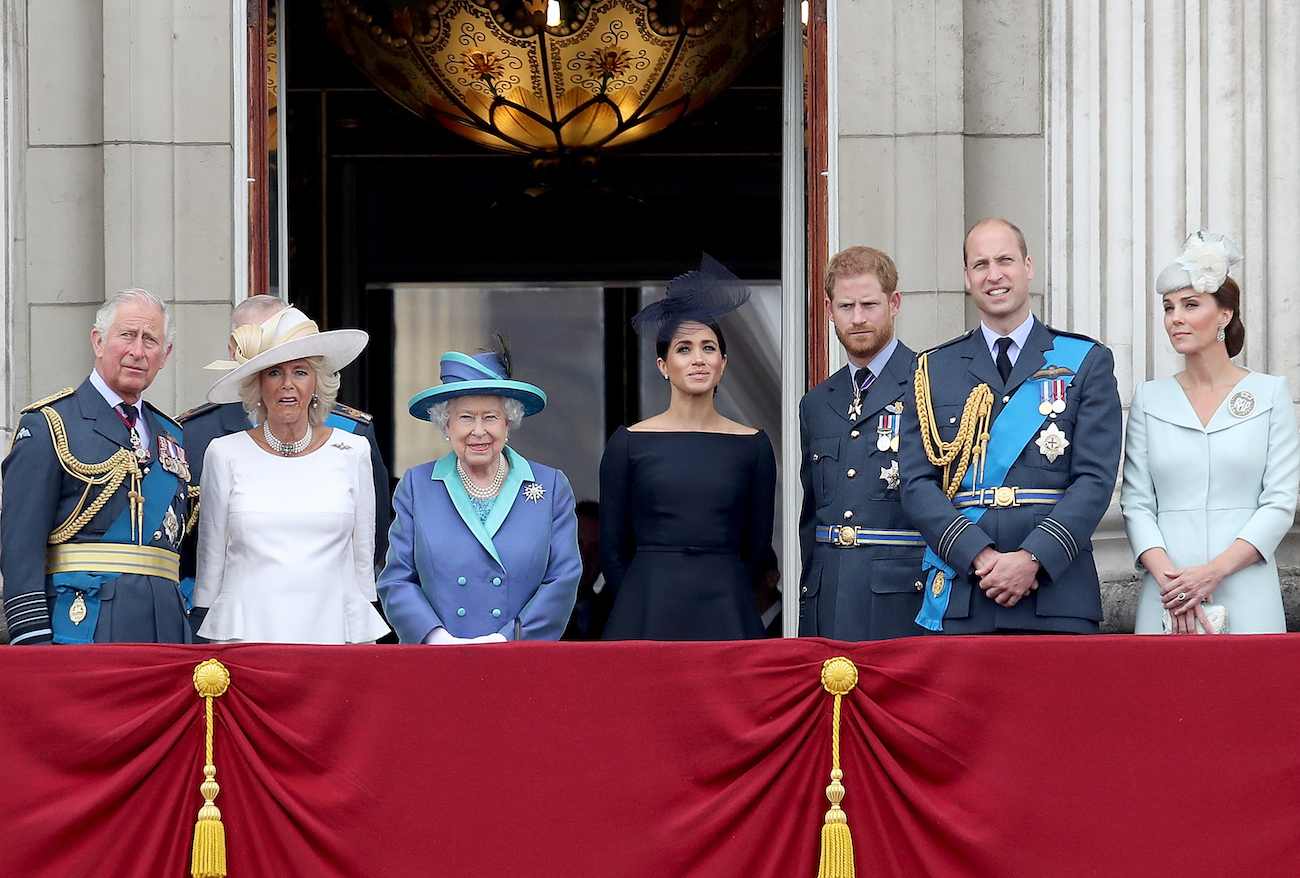 Several members of the royal family standing on a balcony