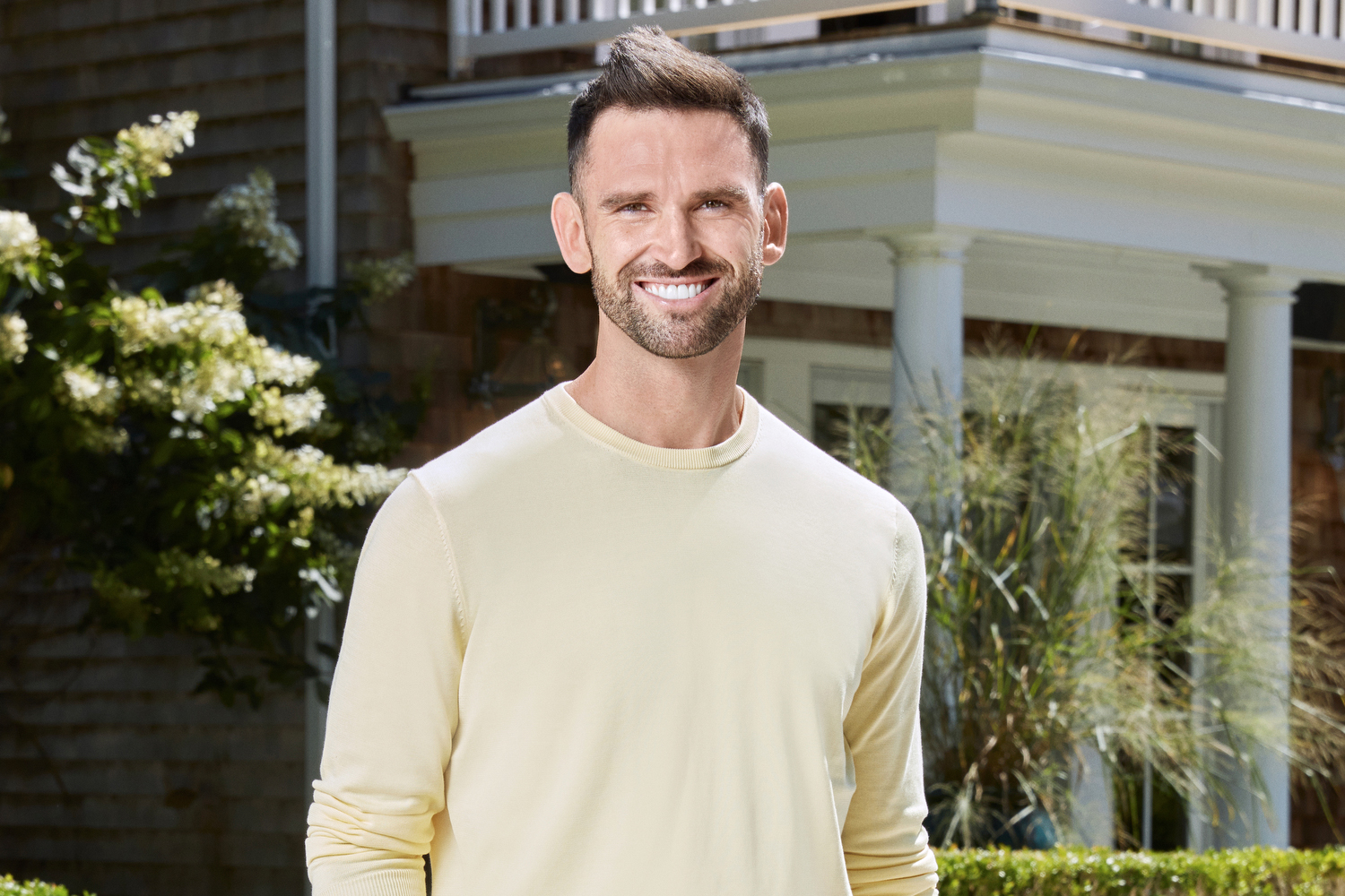 Carl Radke posing and smiling for his 'Summer House' portrait