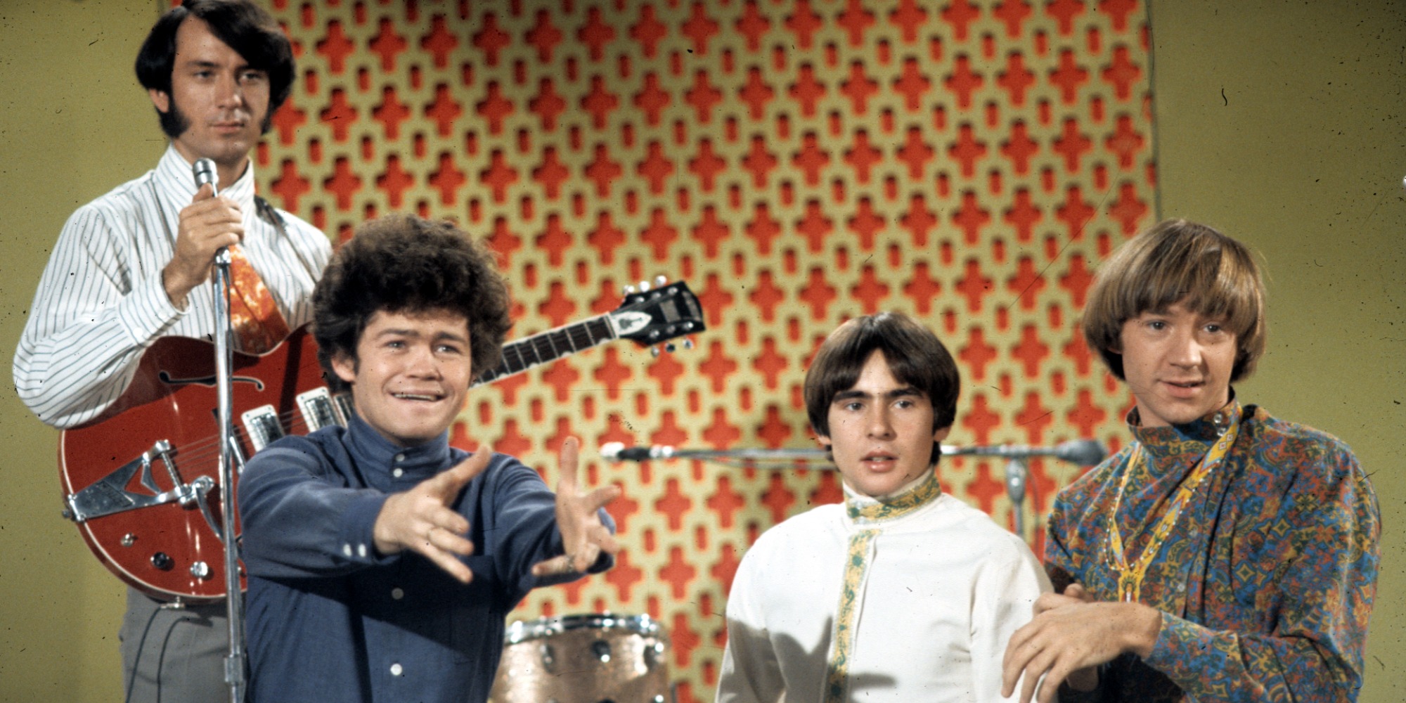 The Monkees pose for a publicity photo on the set of The Monkees television show.