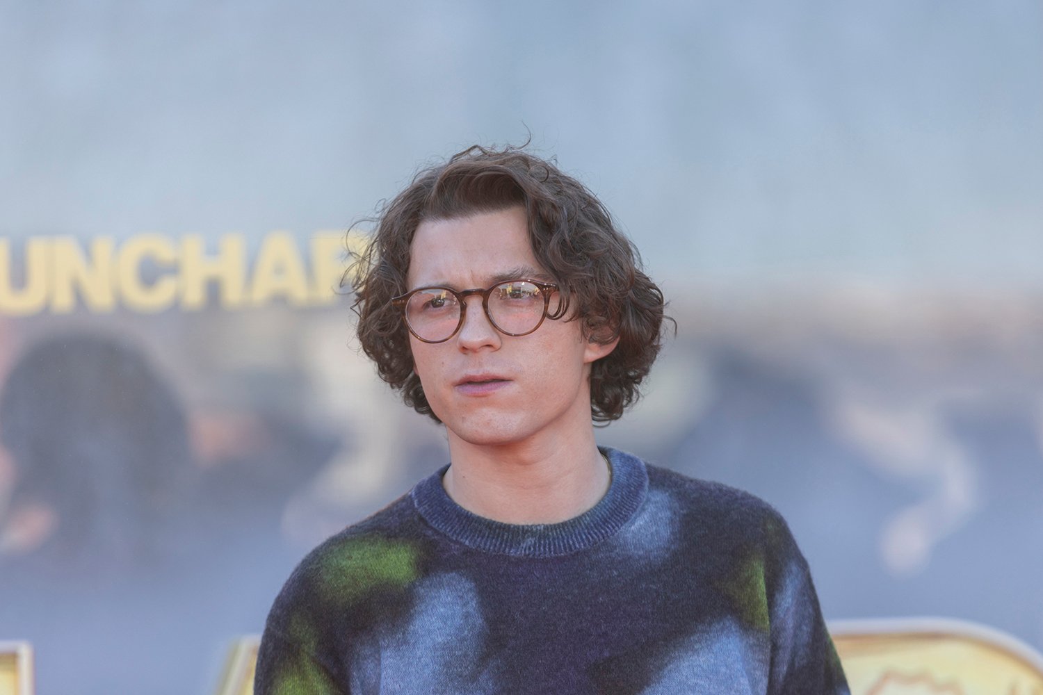 Tom Holland at a press event for his new movie Uncharted