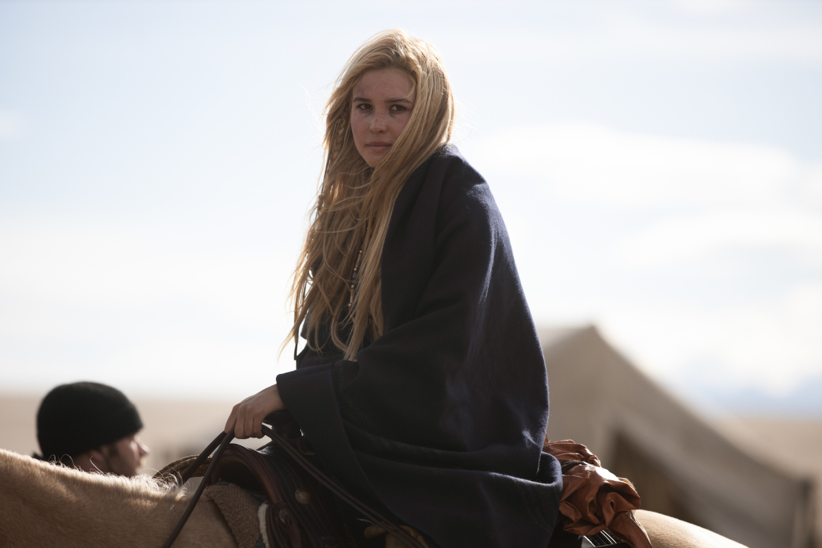 Isabel May as Elsa in the 1883 finale. Elsa sits on her horse looking unwell.