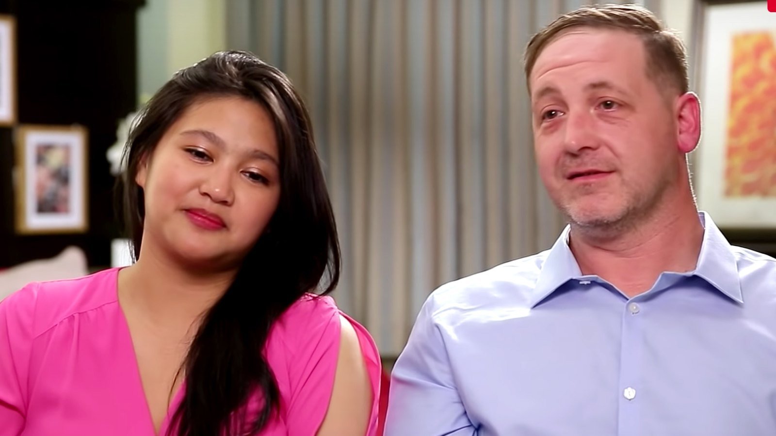 90 Day Fiancé stars Leida, in a pink top, and Eric, in a purple button-down shirt