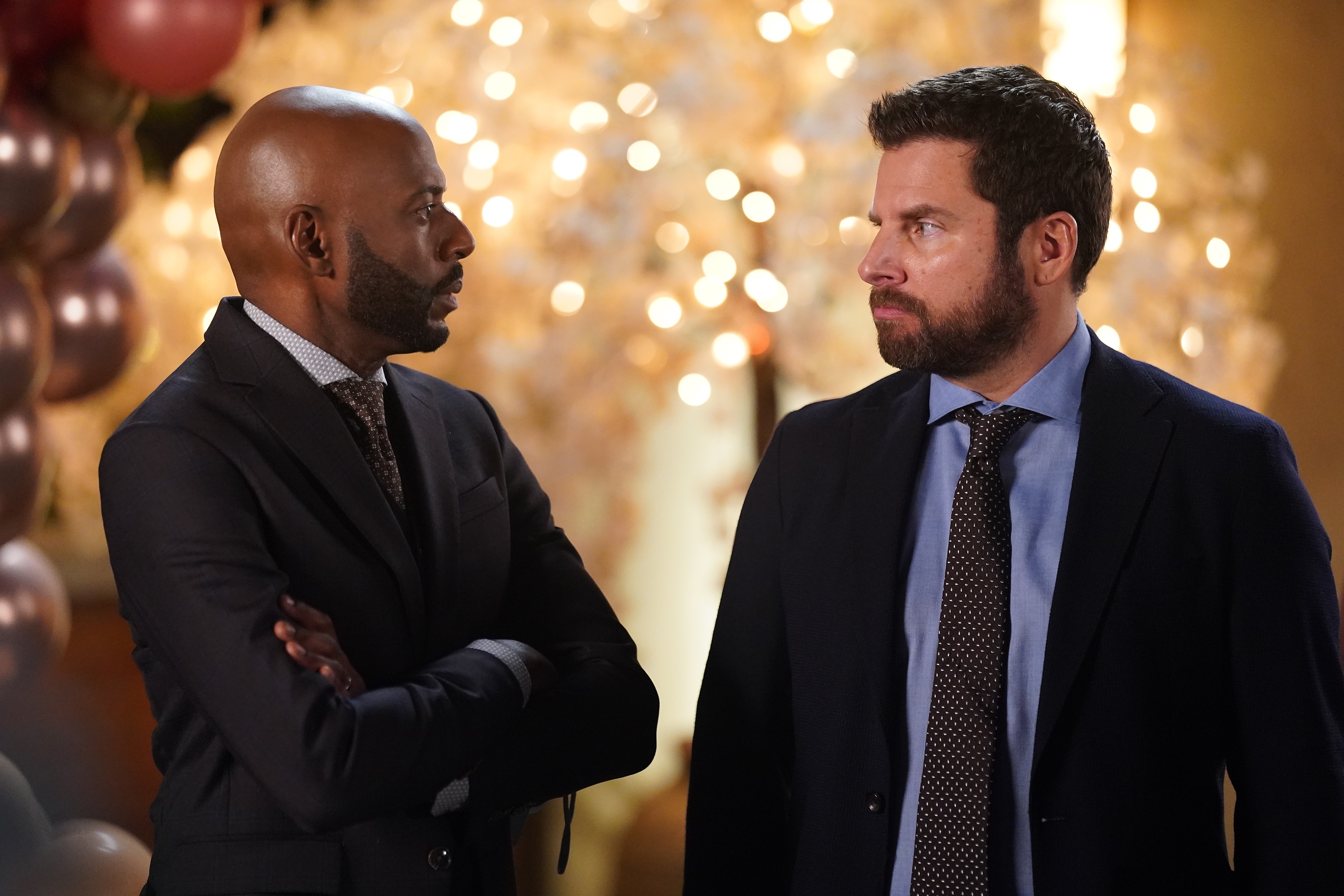 'A Million Little Things' Romany Malco and James Roday Rodriguez staring at each other as Rome and Gary
