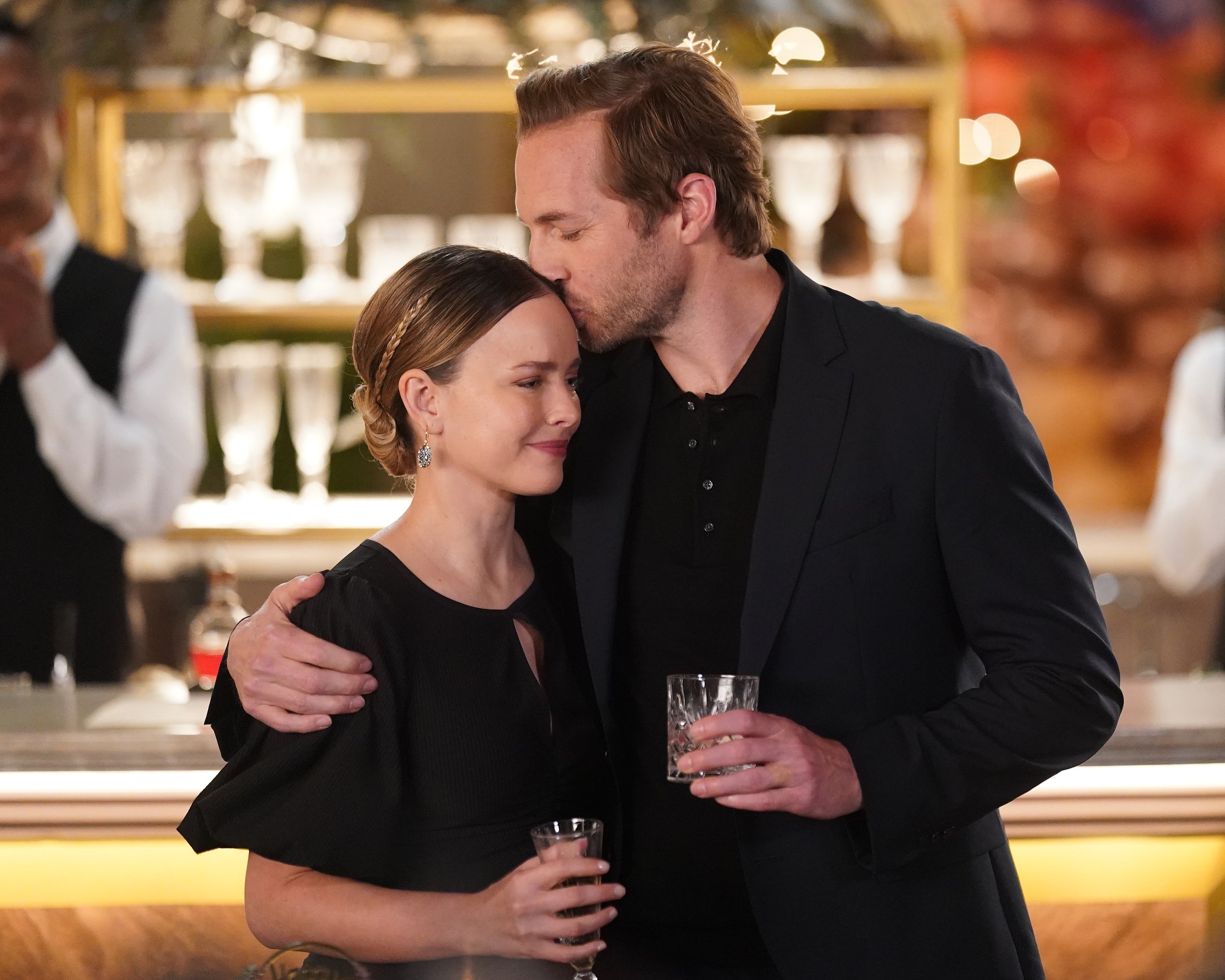 'A Million Little Things' Allison Miller leaning on Ryan Hansen as he kissed her head portraying Maggie and Cam