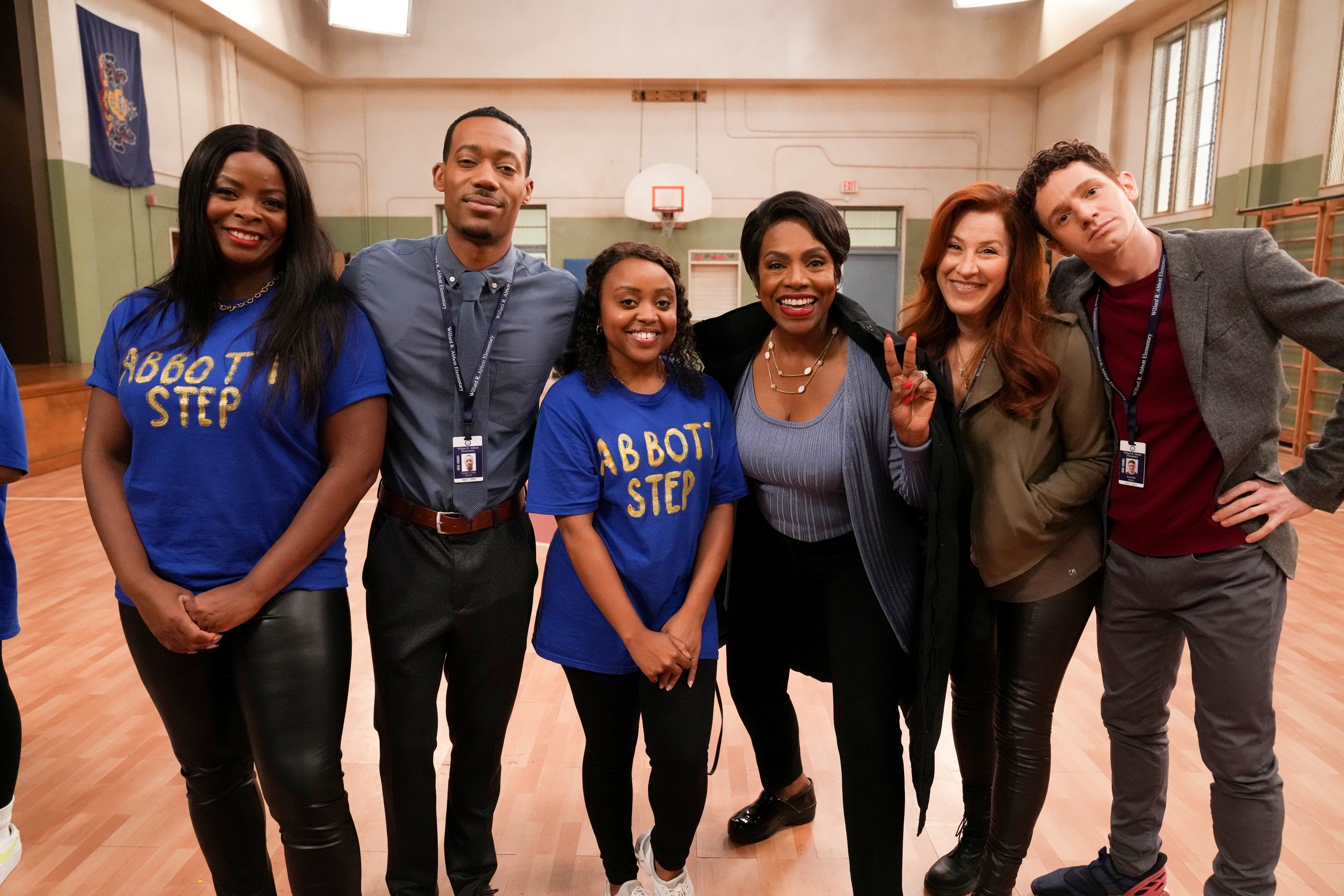 Janelle James, Tyler James Williams, Quinta Brunson, Sheryl Lee Ralph, Lisa Ann Walter, and Chris Perfetti standing together and smiling for a picture