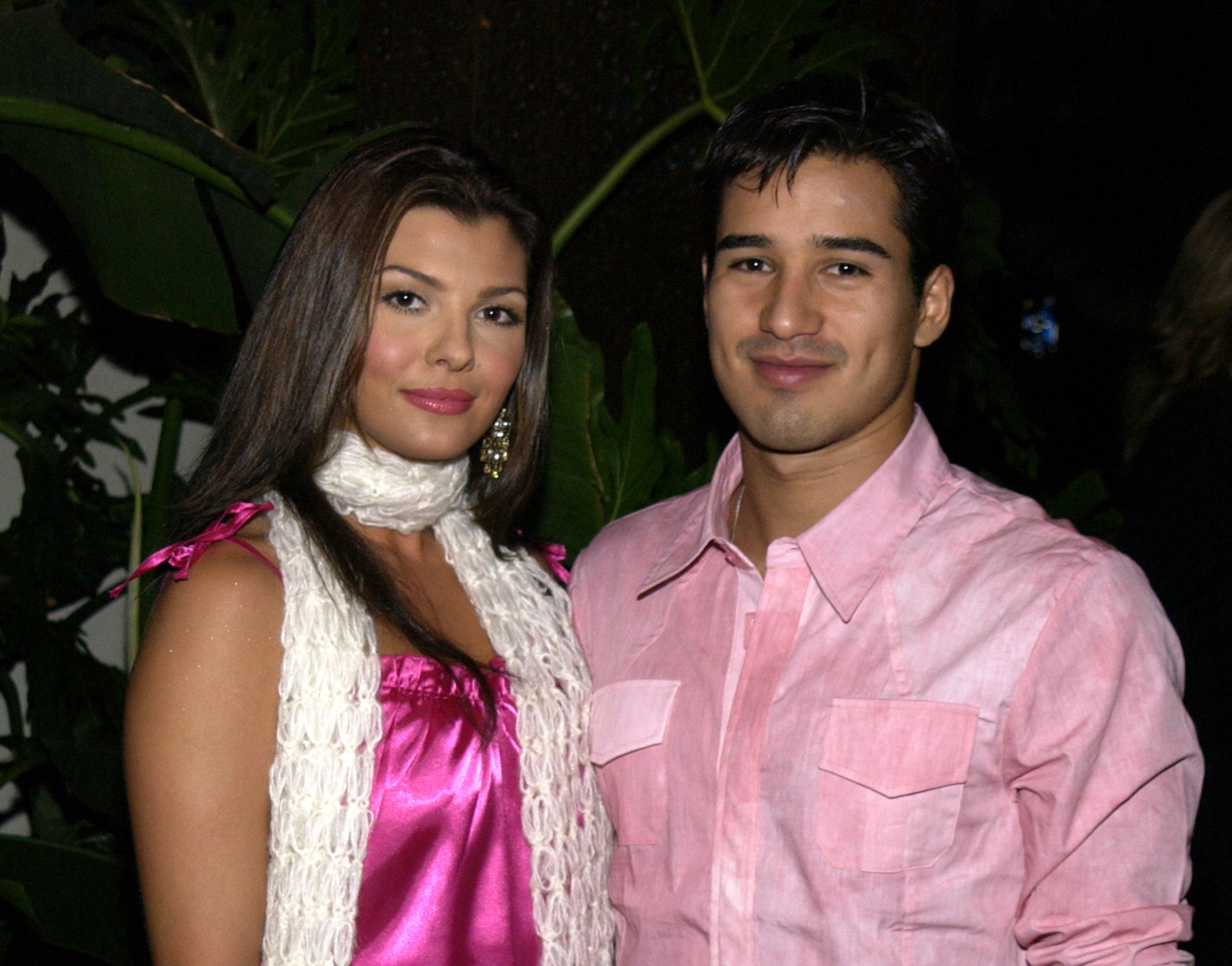 Ali Landry and Mario Lopez pose on the red carpet.
