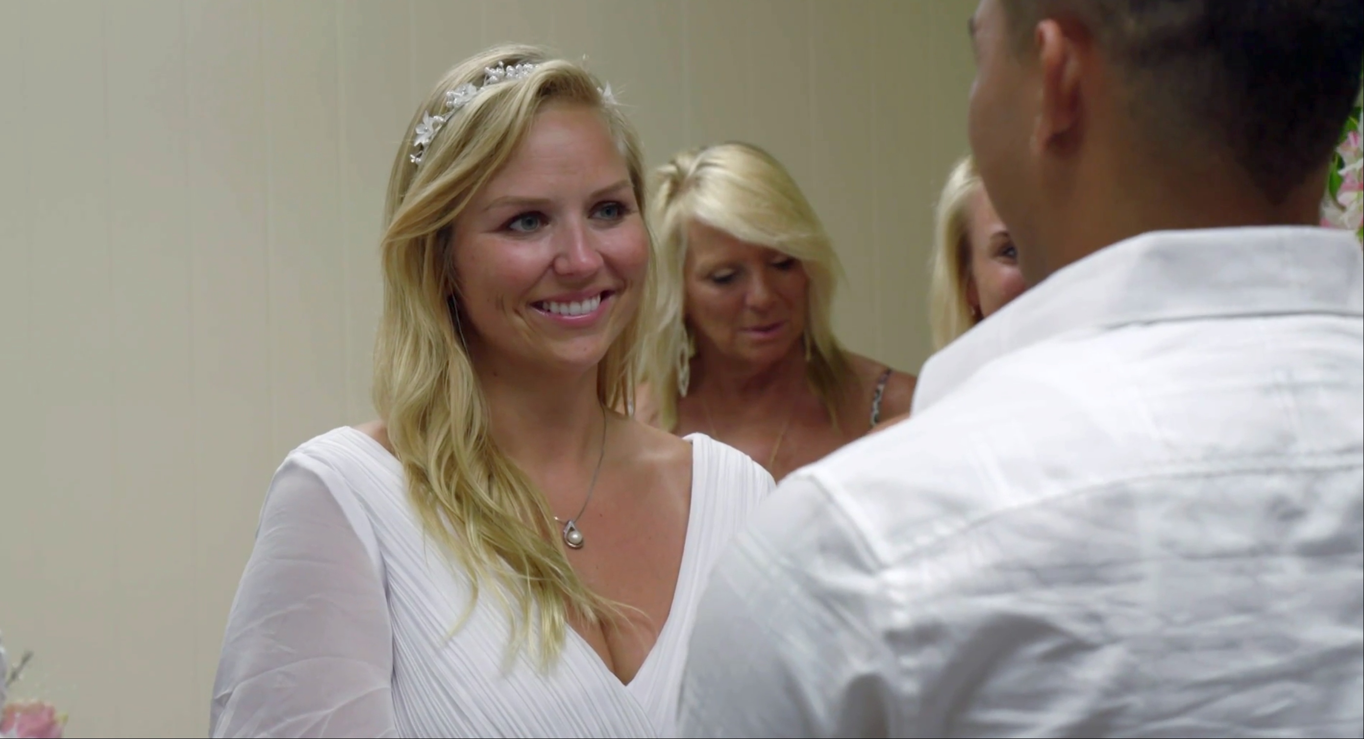 In a scene from '90 Day Diaries' with Amber and Daniel, Amber is wearing a white wedding dress with a flower crown during her wedding to Daniel.