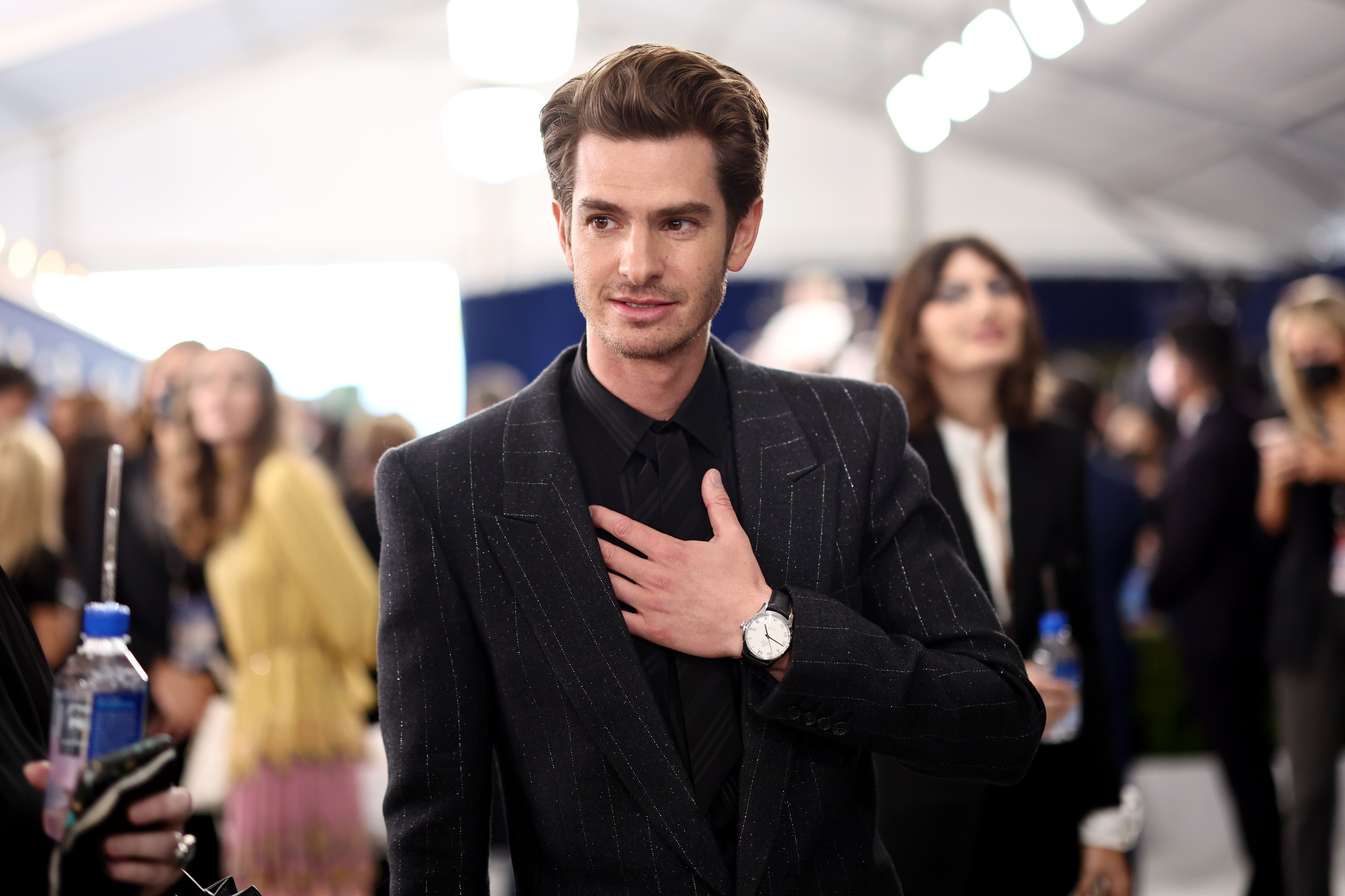 Andrew Garfield, who is featured at the ending of 'Spider-Man: No Way Home,' wears a black suit with faded white stripes over a black button-up shirt and black tie.