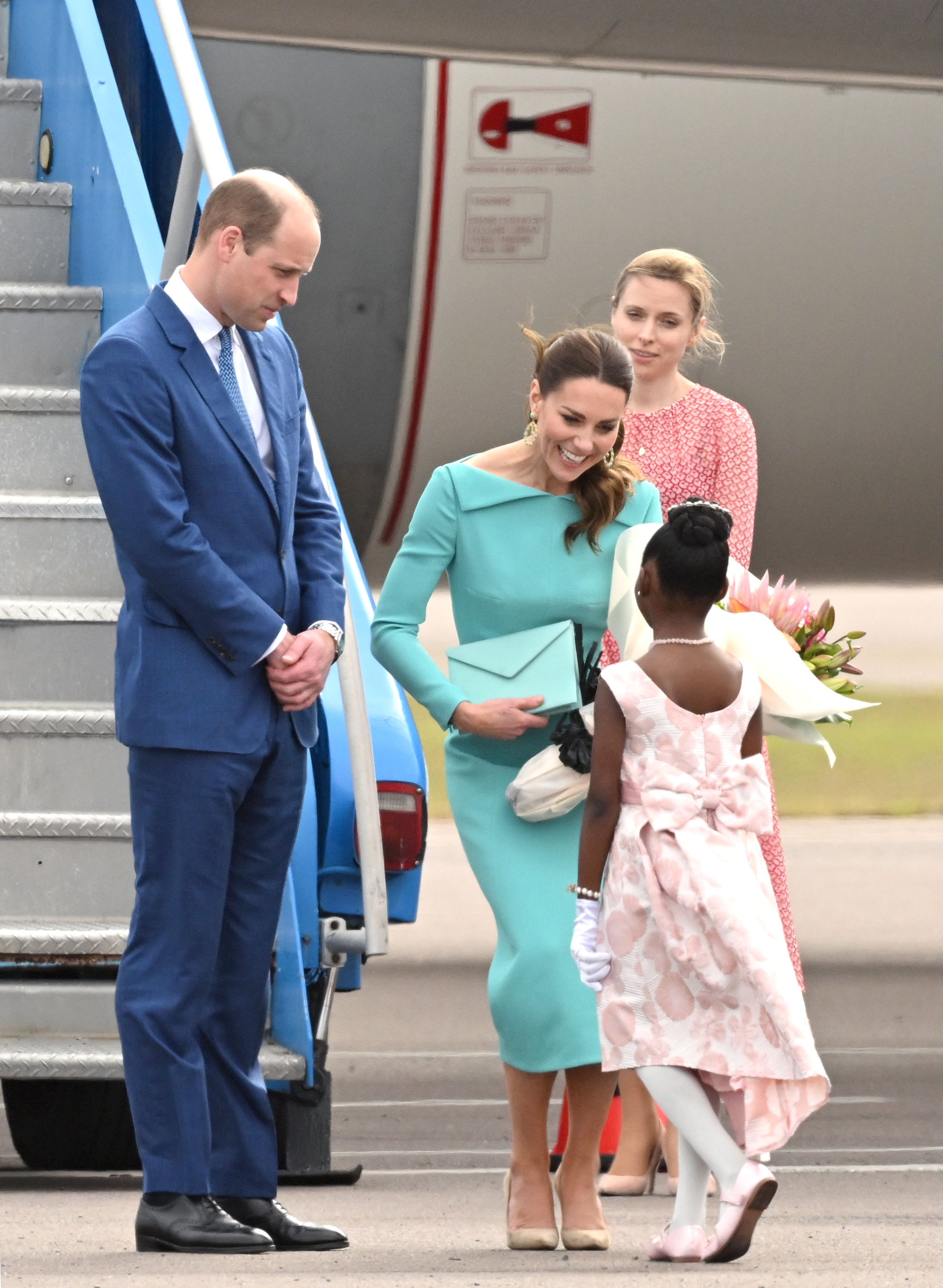 Aniah Moss gives Kate Middleton bouquet of flowers upon arrival in Nassau, Bahamas