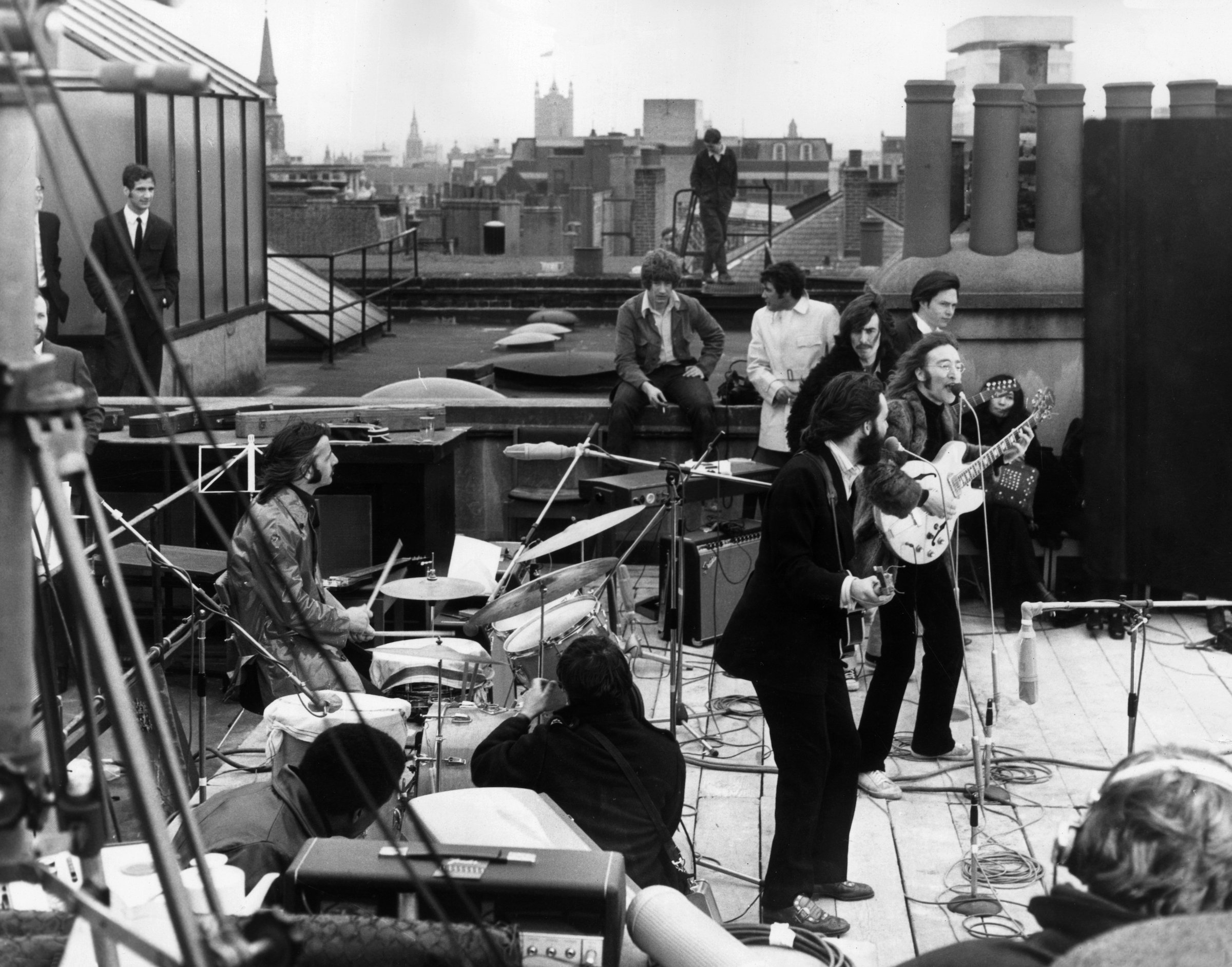 British rock group The Beatles performing their last live public concert on the rooftop of the Apple Organization building