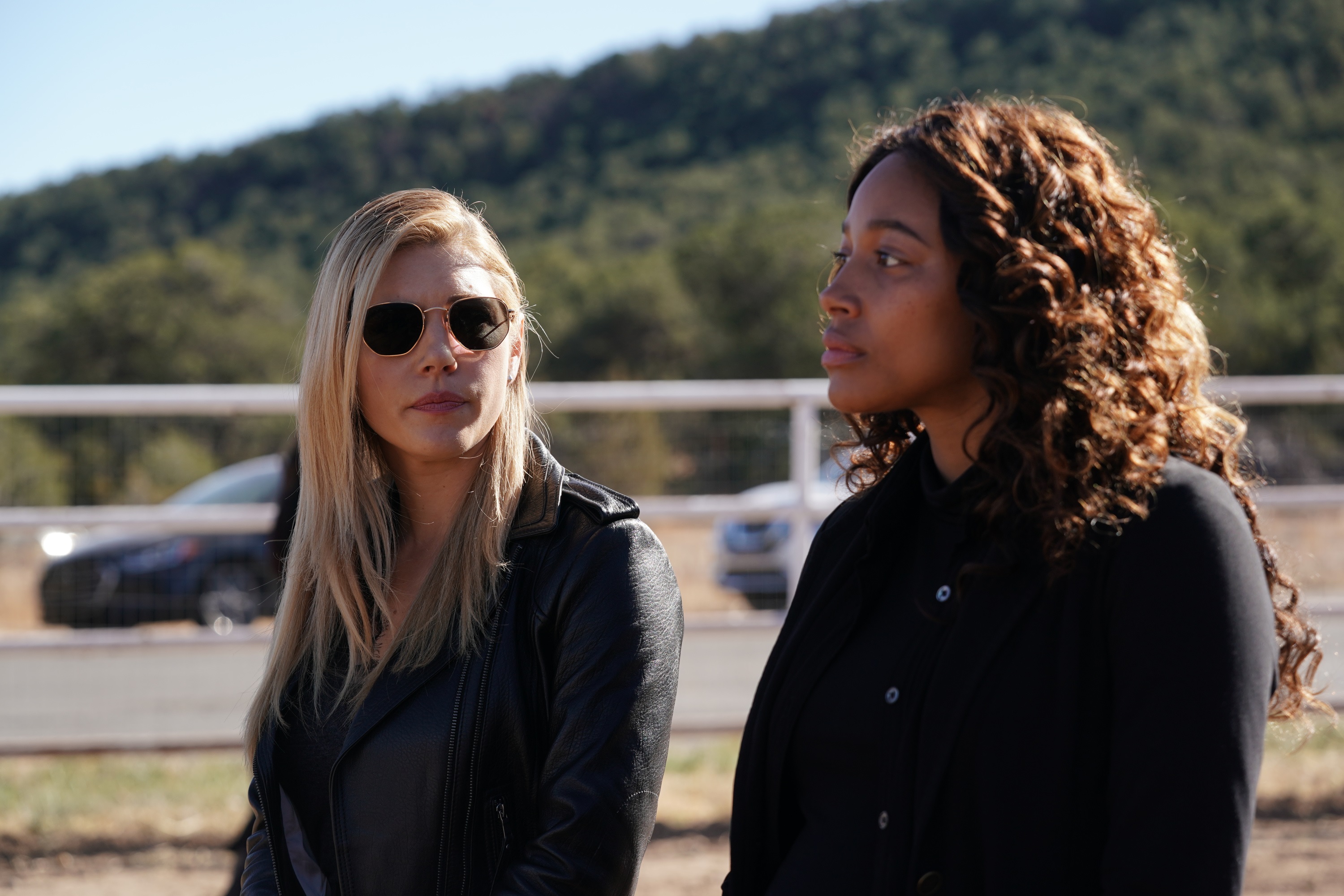 Katheryn Winnick and Kylie Bunbury stand next to each other as Jenny and Cassie in 'Big Sky' Season 2
