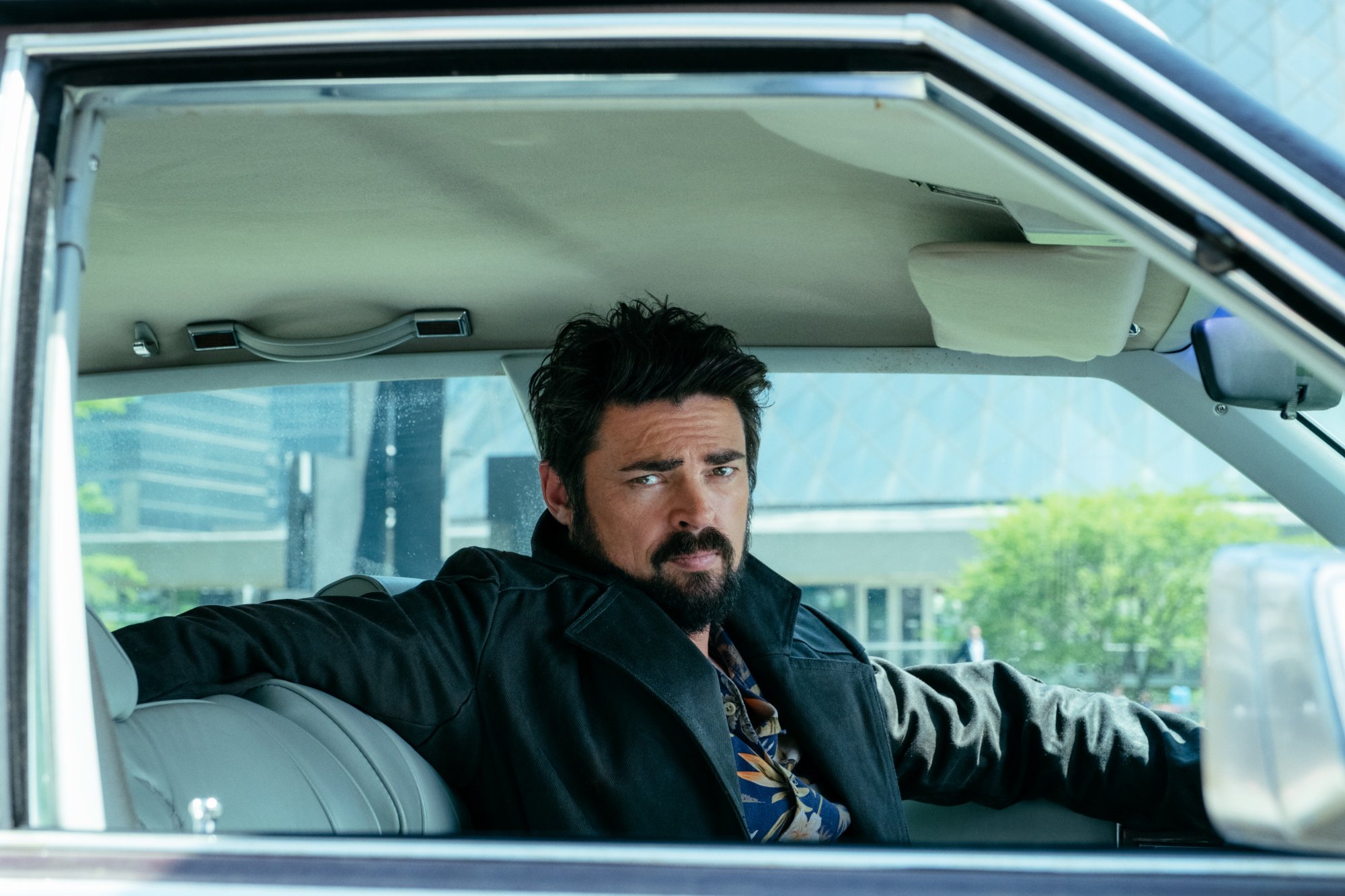 Karl Urban as Billy Butcher in 'The Boys' Episode 1. He's sitting in his car.