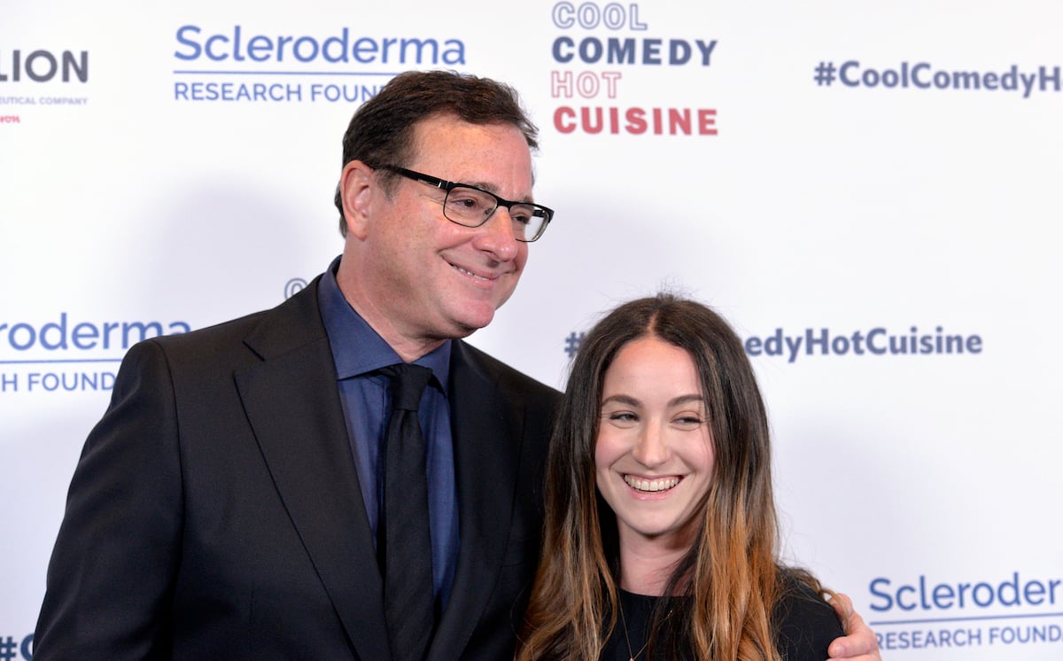 Bob Saget laughs with his oldest daughter Aubrey Saget at an event.