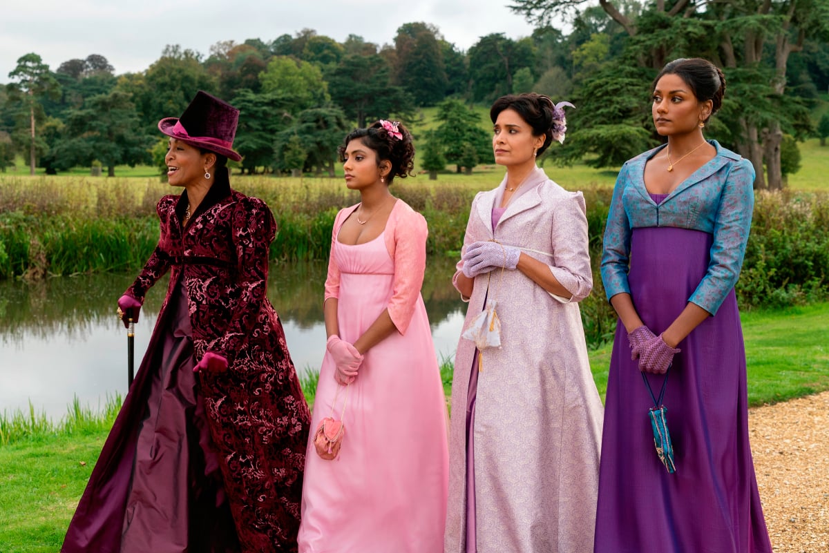 Lady Danbury walks with the Sharma family in Bridgerton Season 2.