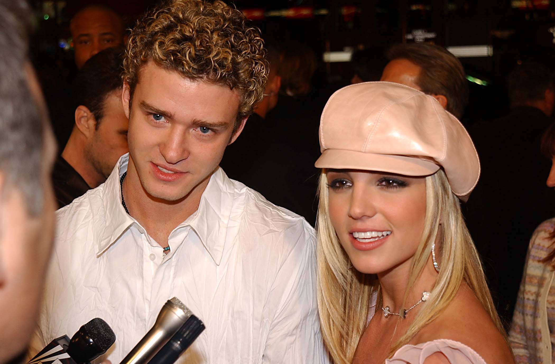 Justin Timberlake & Britney Spears talking to a reporter