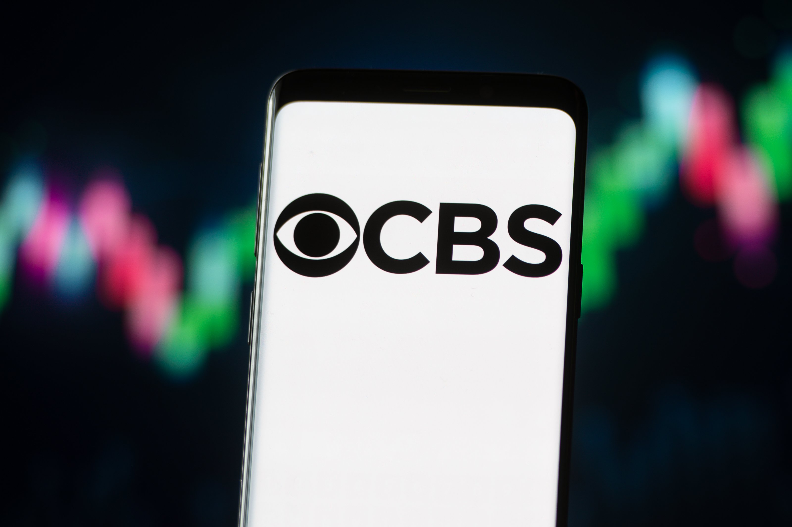 In this photo illustration a CBS logo seen displayed on a smartphone