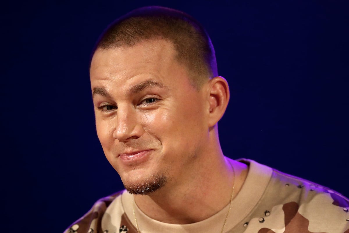 Channing Tatum raises his eyebrows and smiles