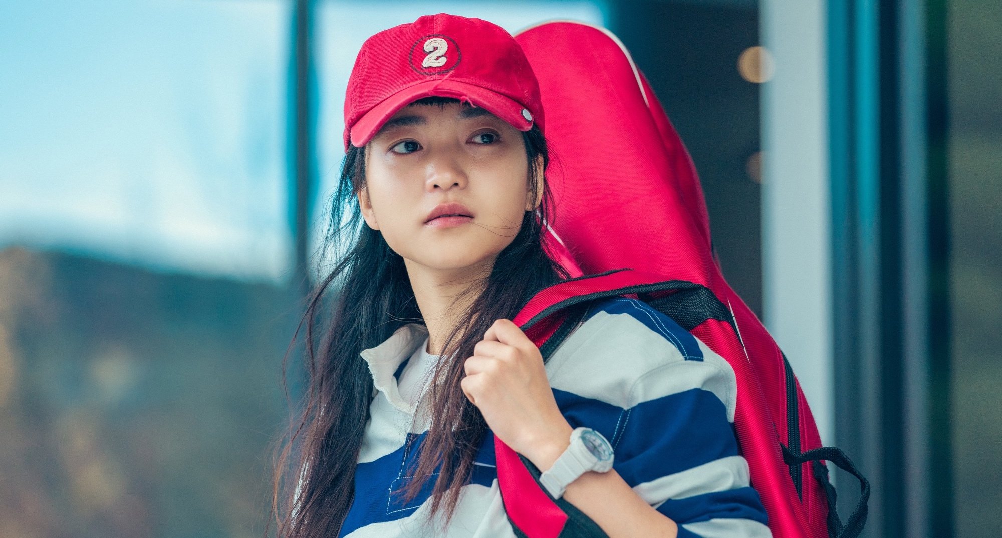 Character Na Hee-do in 'Twenty-Five Twenty-One' K-drama wearing red baseball hat.