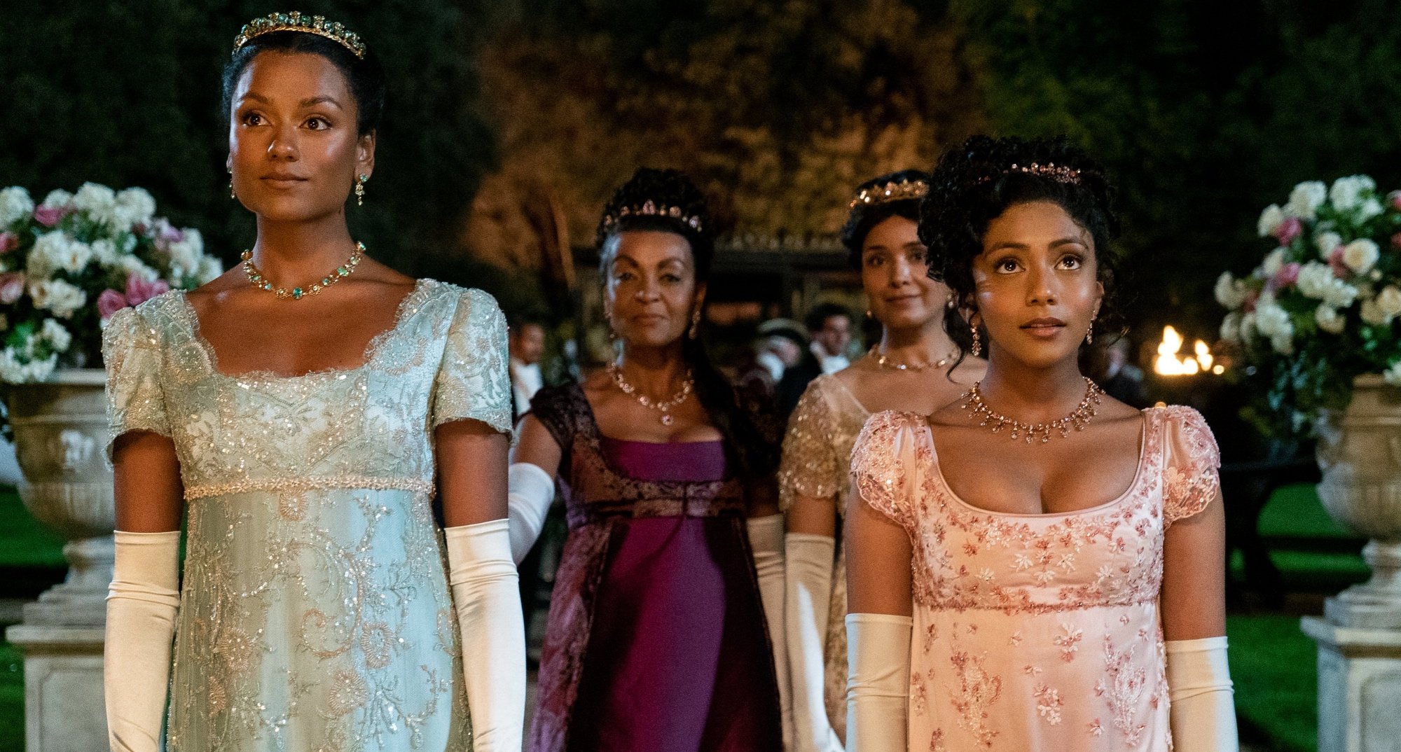 Characters Kate and Edwina for Shonda Rhimes 'Bridgerton' Season 2 wearing beaded gowns with Lady Danbury.