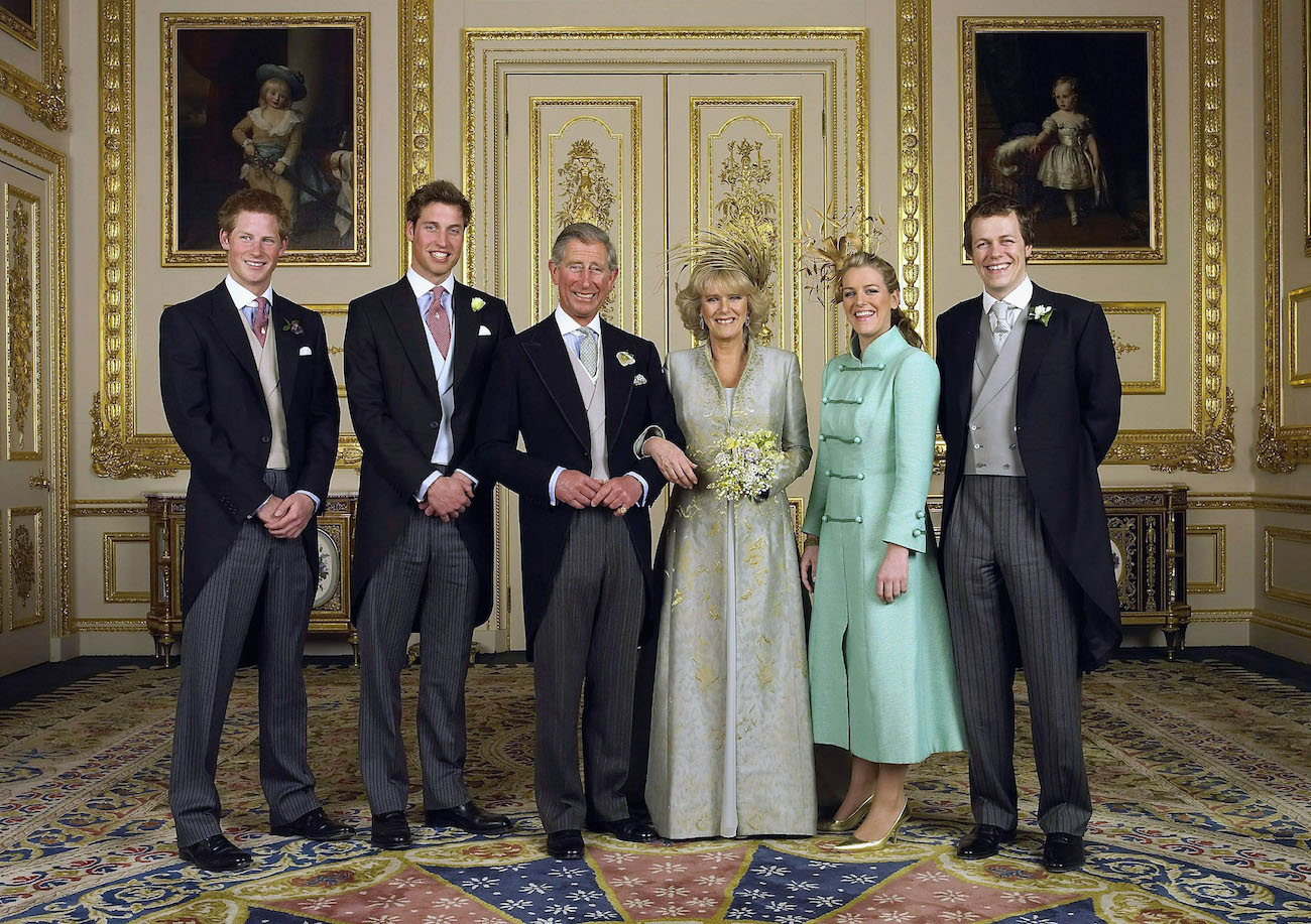 Prince Charles and Camilla Parker Bowles standing in a room at Windsor Castle with their children during their 2005 wedding