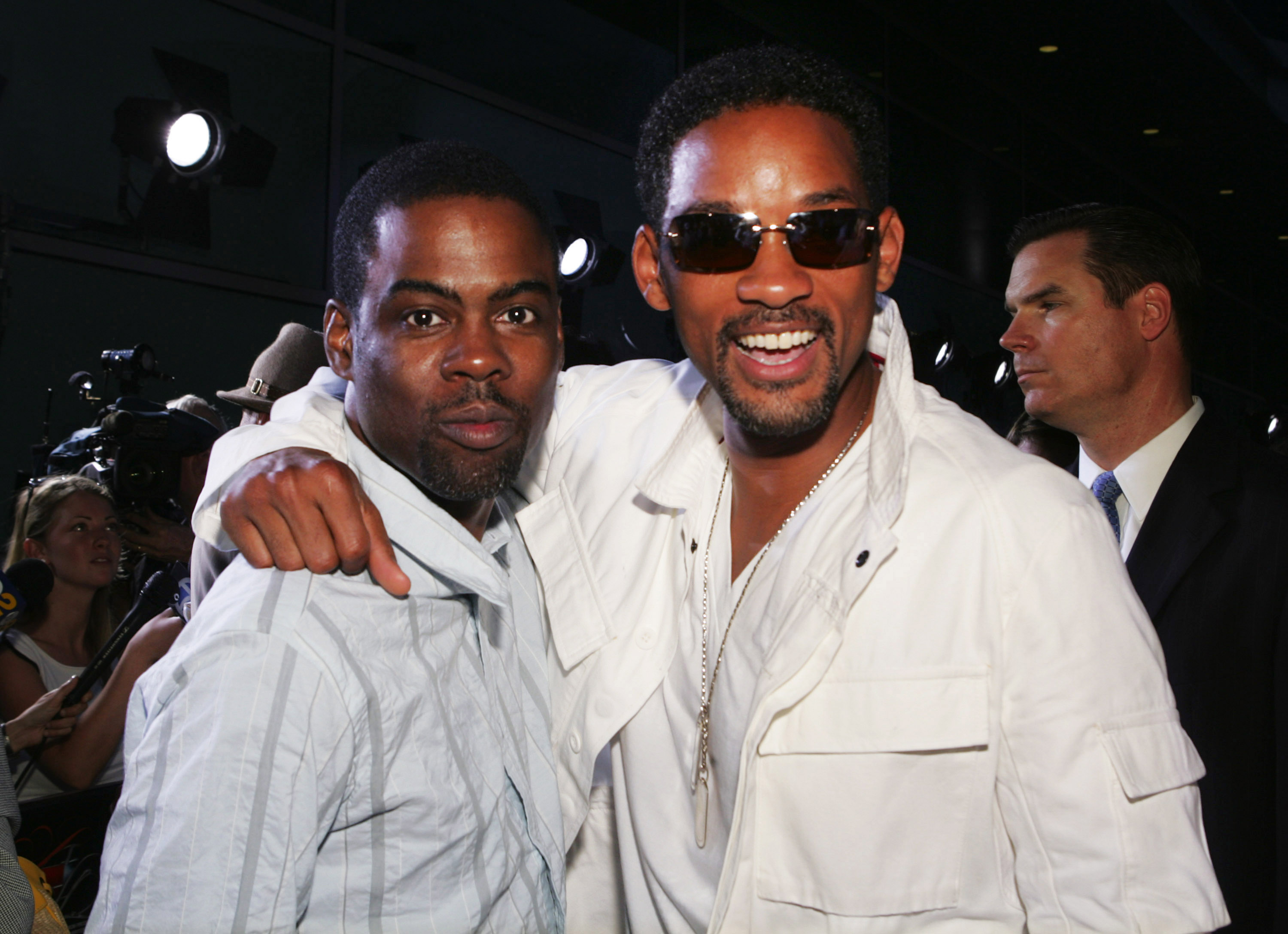Chris Rock, who got slapped by and Will Smith even though Smith made bald jokes in the past, posing together at the Hustle & Flow premiere in 2005