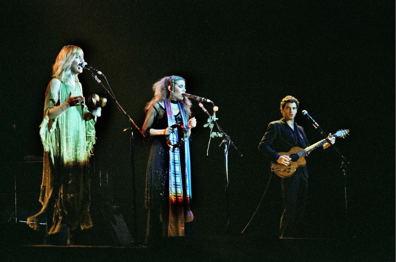 Christine McVie, Stevie Nicks, and Lindsey Buckingham performing with Fleetwood Mac in 1980.