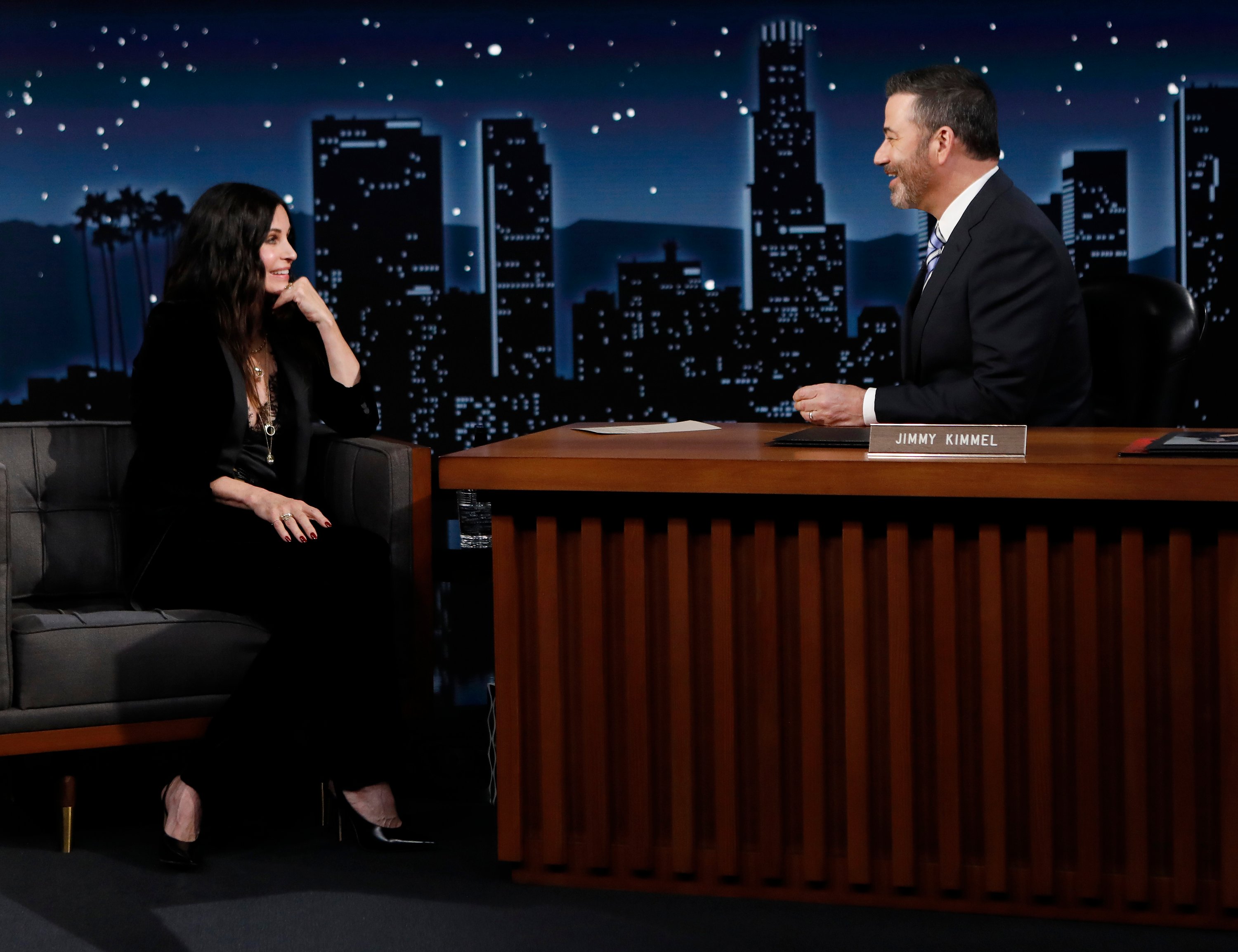 Courteney Cox sitting on the set of 'Jimmy Kimmel Live!'