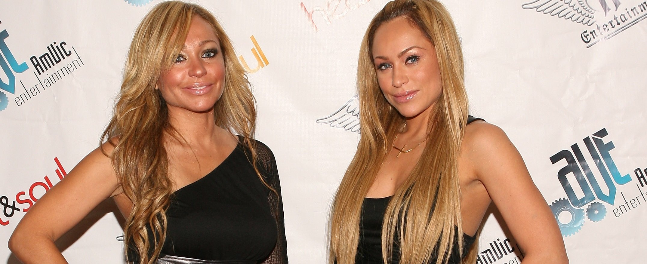 Darcey and Stacey Silva, stars of 'Darcey & Stacey,' wearing matching black outfits. Fans are wondering if Darcey's relationship with Georgi was ever really real.