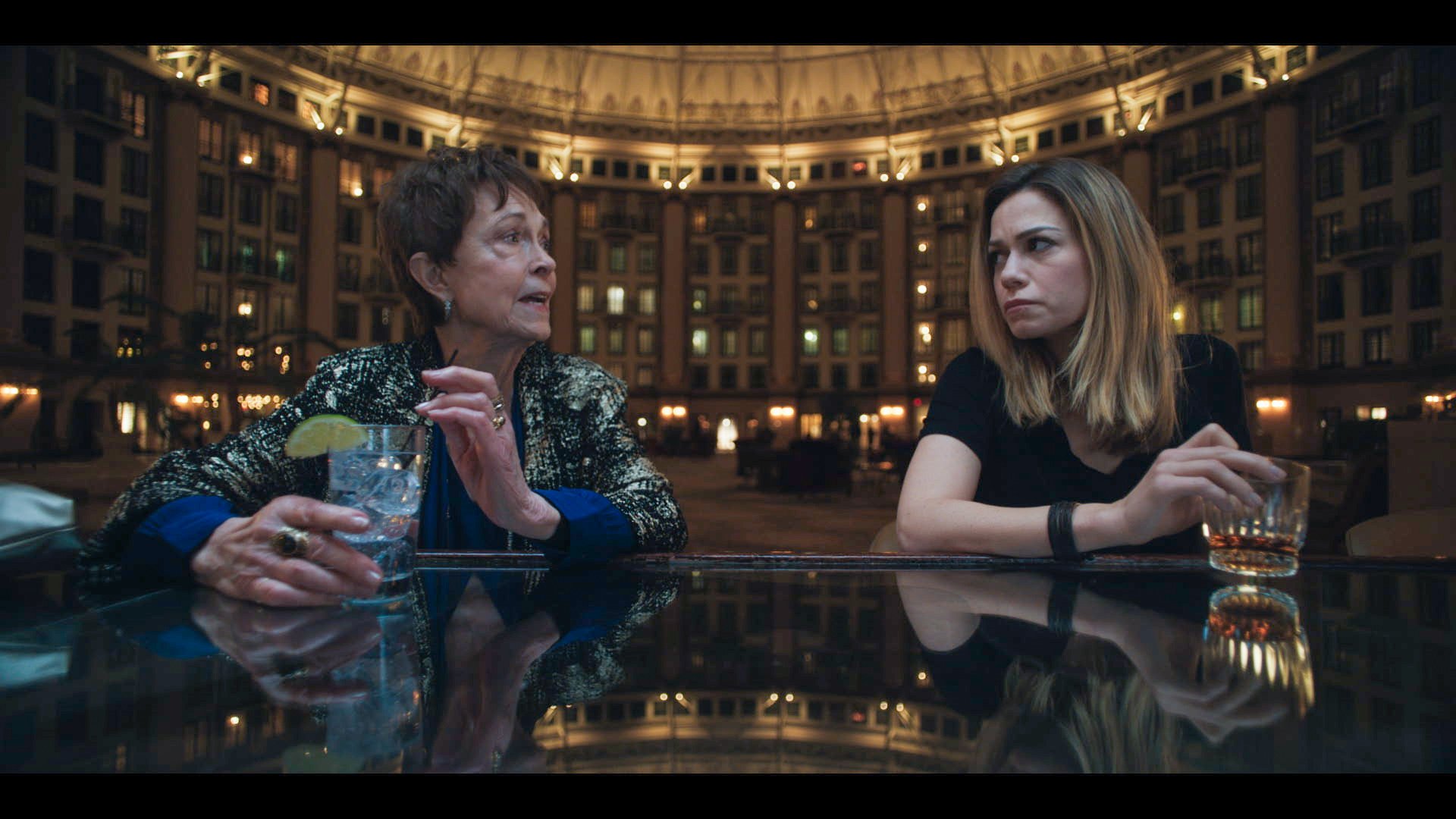 'So Cold the River' set in the West Baden Springs Hotel stars Bethany Joy Lenz. In a still from the movie, Lenz sits at a bar next to co-star Deanna Dunagan.