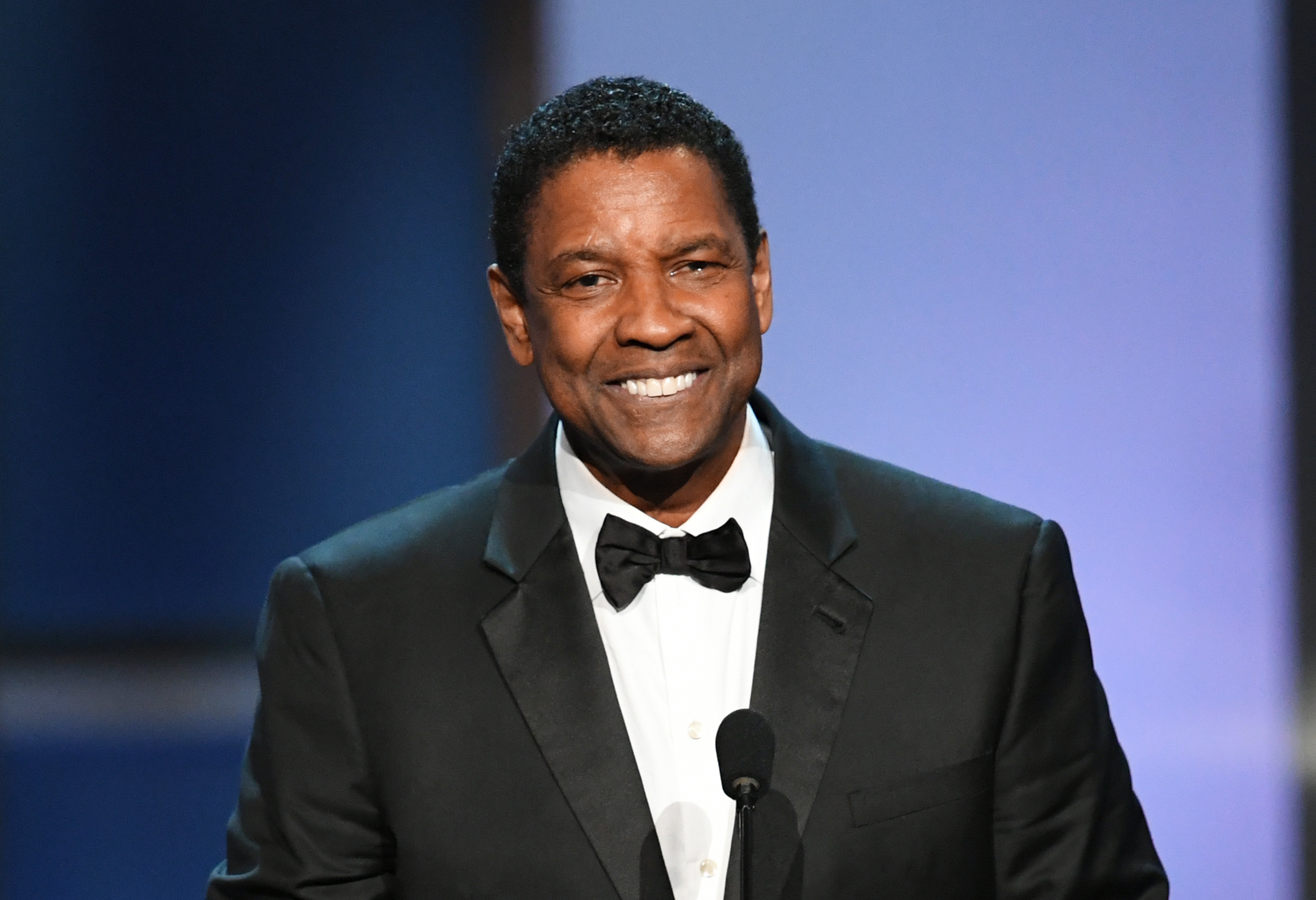Denzel Washington. who owns mansions in Beverly Hills and New York, speaks onstage during the 47th AFI Life Achievement Award