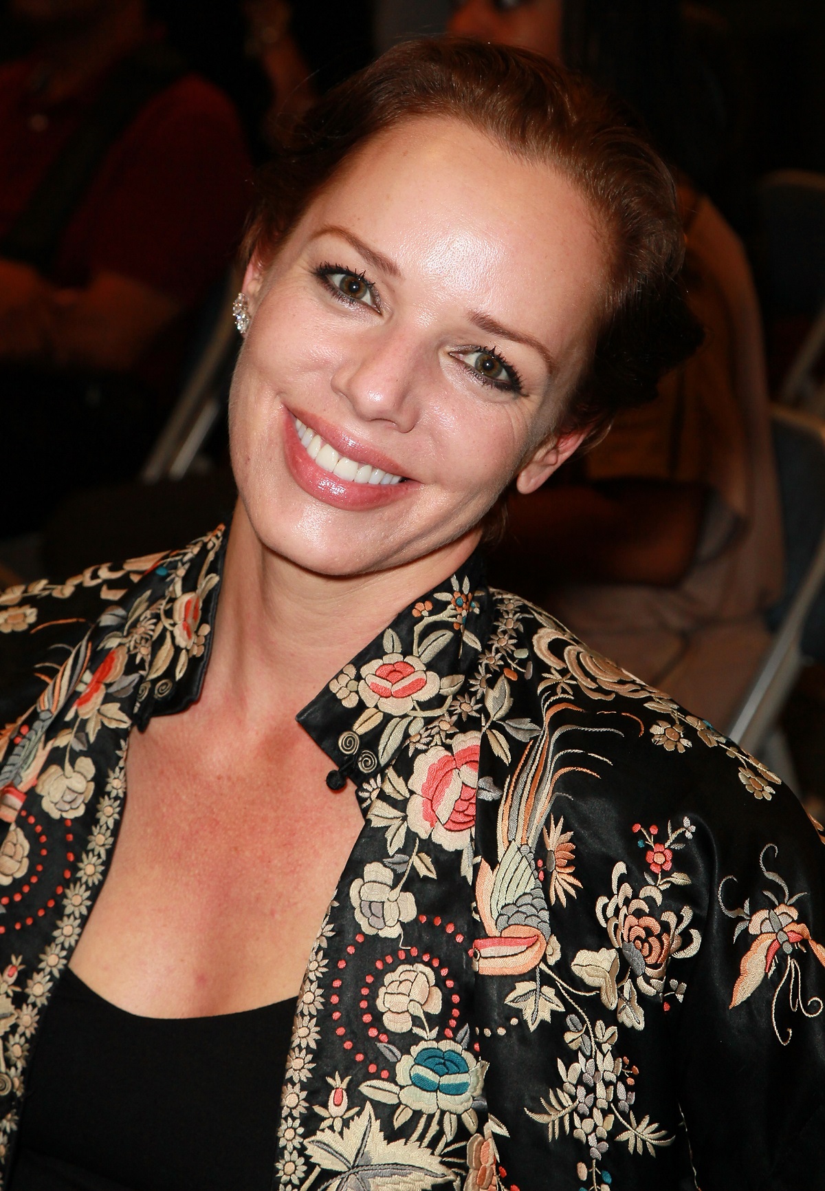 'The Young and the Restless' actor Diana Barton wearing a black shirt and a black floral jacket.