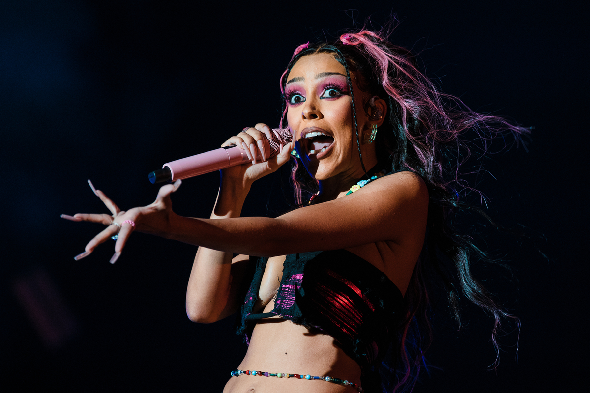 Doja Cat performs wearing a black and pink crop top during Lollapalooza Brazil Music Festival in Sao Paulo, Brazil.
