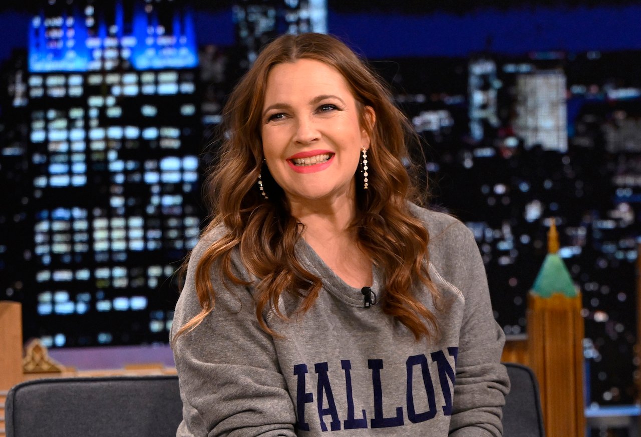 Drew Barrymore in a gray sweatshirt during an interview on 'The Tonight Show'