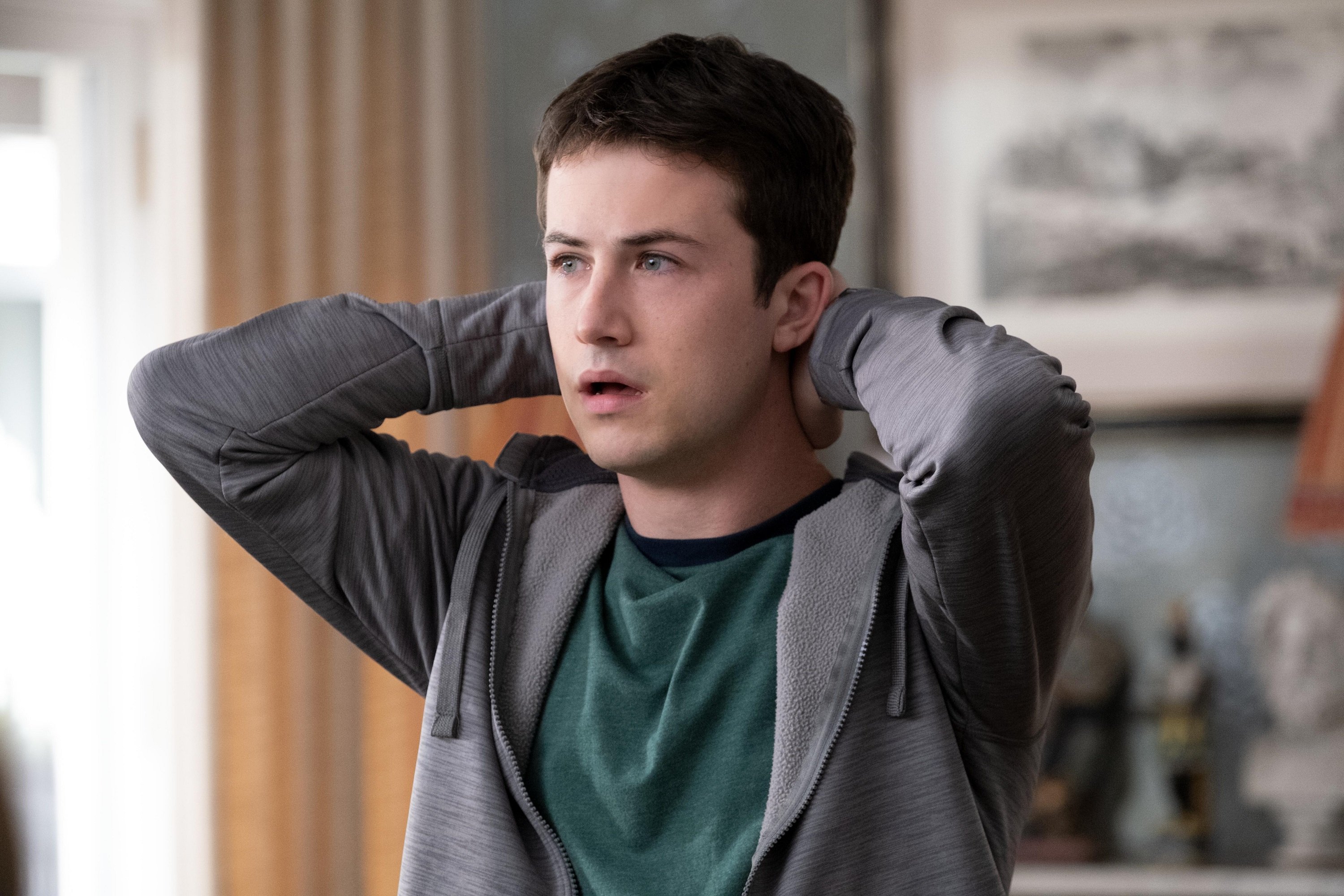 'The Dropout' Dylan Minnette looks worried with his hands on the back of his neck as Tyler Shultz