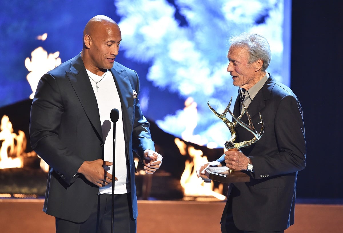 Dwayne Johnson talking to Clint Eastwood.