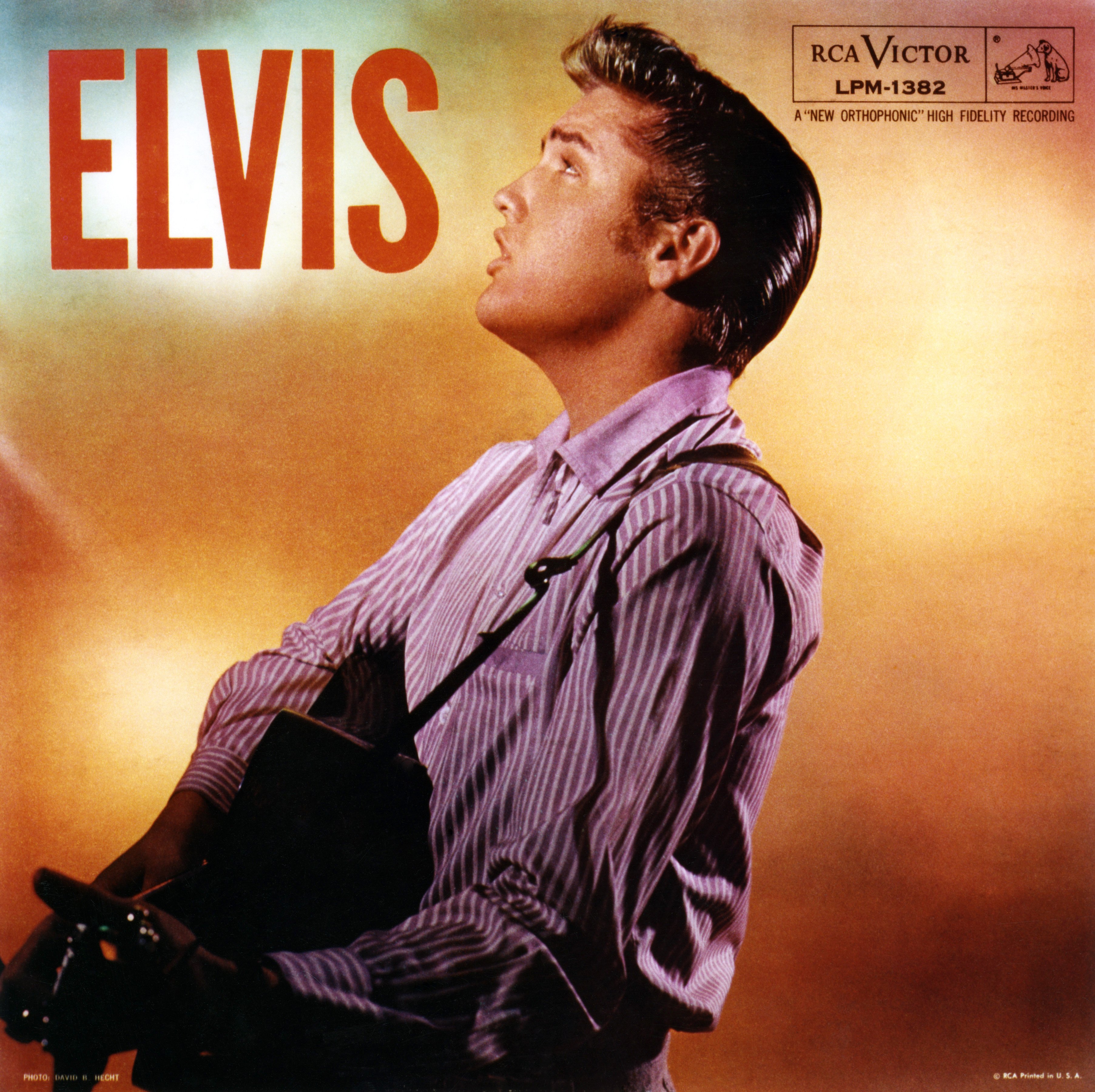 Elvis Presley holding a guitar