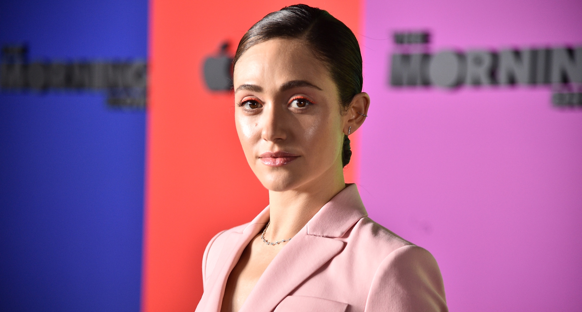 Emmy Rossum will star in 'The Crowded Room' anthology series wearing pink suit.