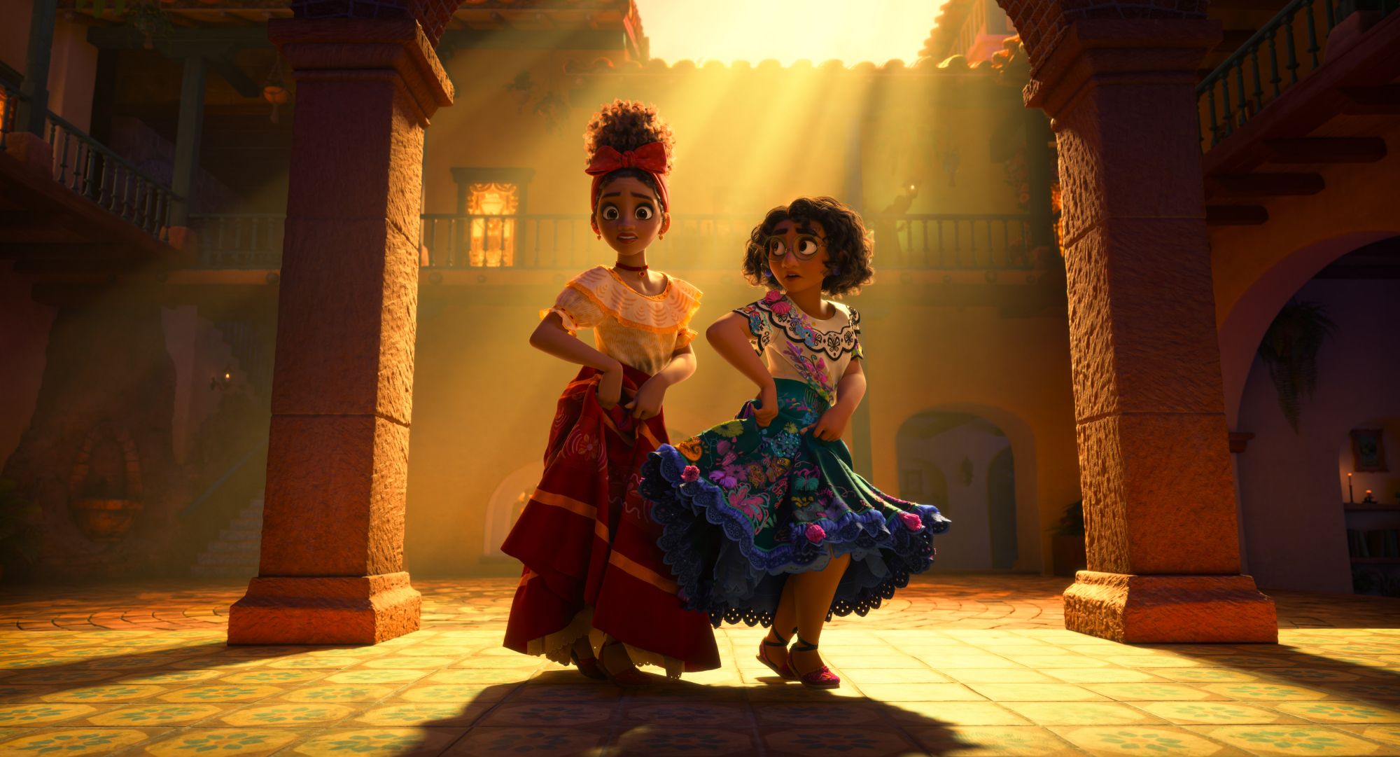 'Encanto' Dolores (voiced by Adassa) and Mirabel (voiced by Stephanie Beatriz) dancing in the front of House Madrigal