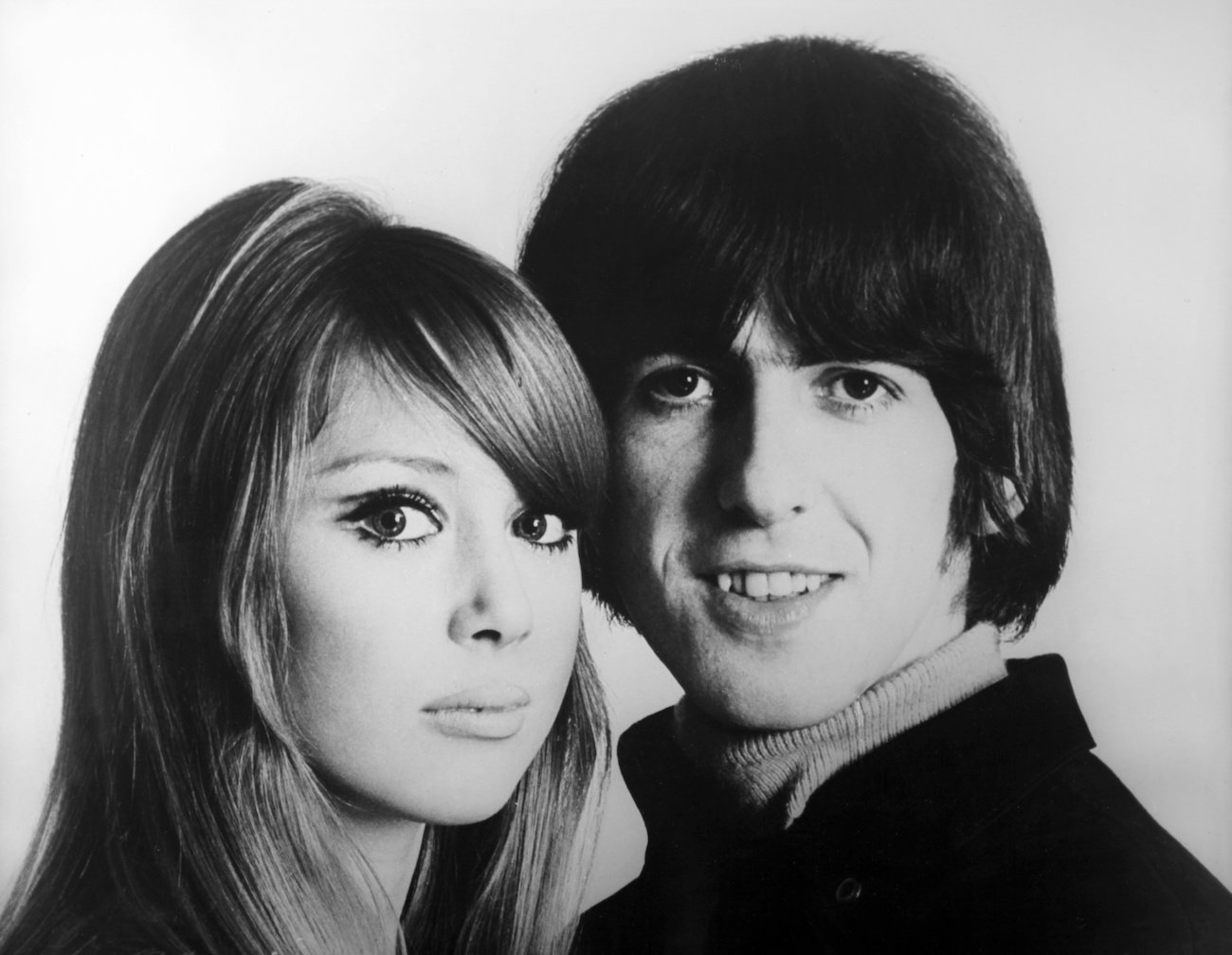Pattie Boyd and George Harrison posing for portraits in 1966.
