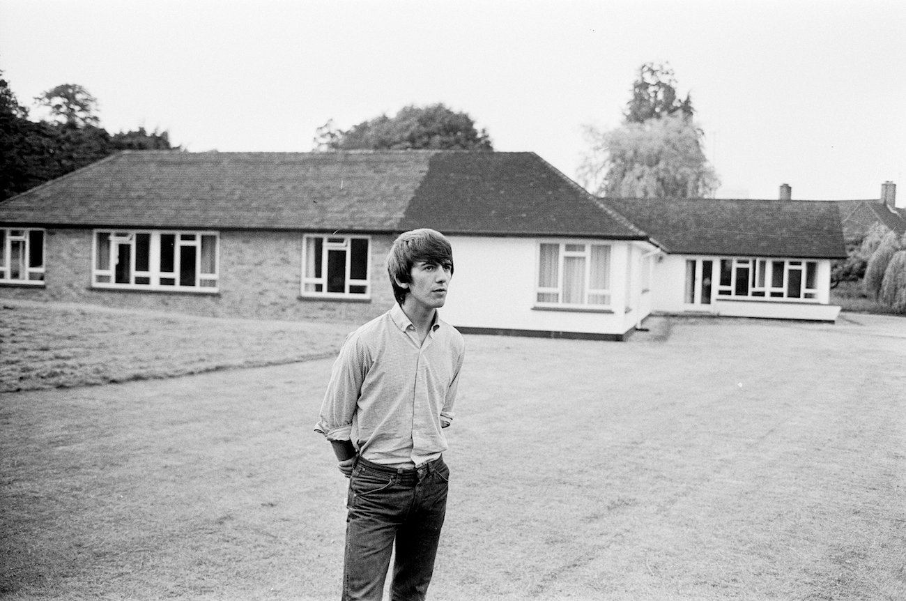 George Harrison wearing white at his home in 1964.