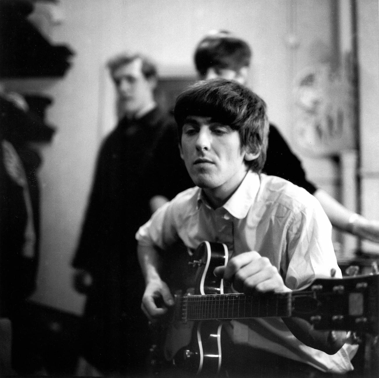 George Harrison backstage at the Finsbury Park Astoria, London, 1963.