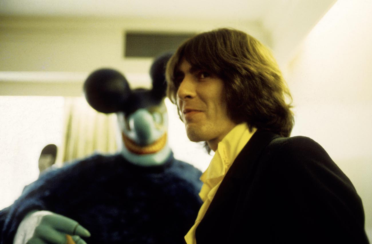 George Harrison with a Blue Meanie at the press screening for 'Yellow Submarine' in 1968.