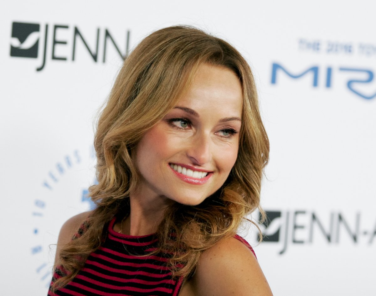 Food Network personality Giada De Laurentiis is photographed in a sleeveless red striped blouse.